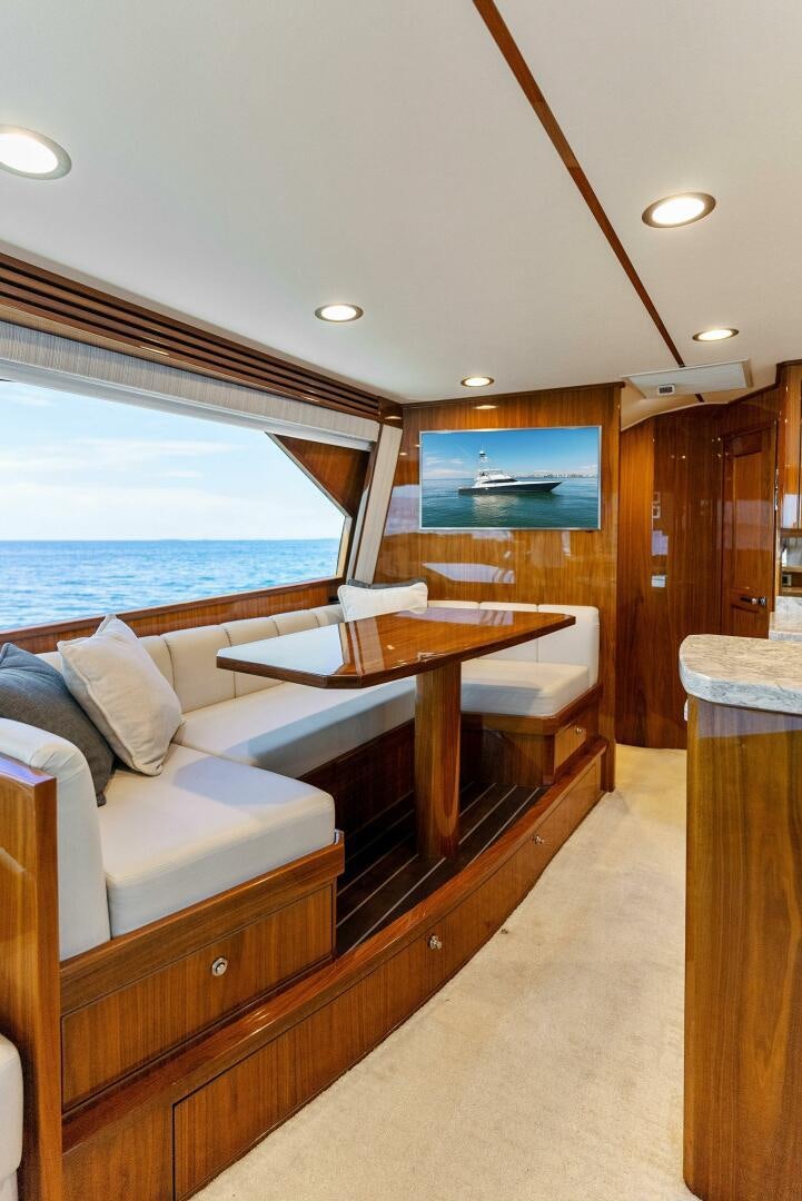 a room with a bed and a table aboard SEA HAWK Yacht for Sale