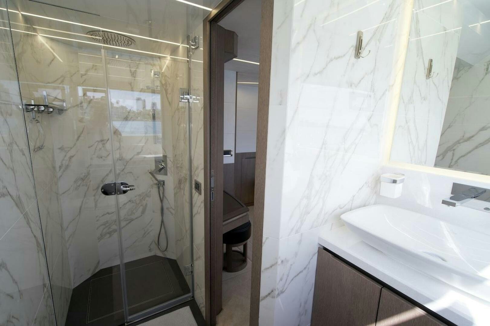 a bathroom with a shower and sink aboard OUR NEXT CHAPTER Yacht for Sale