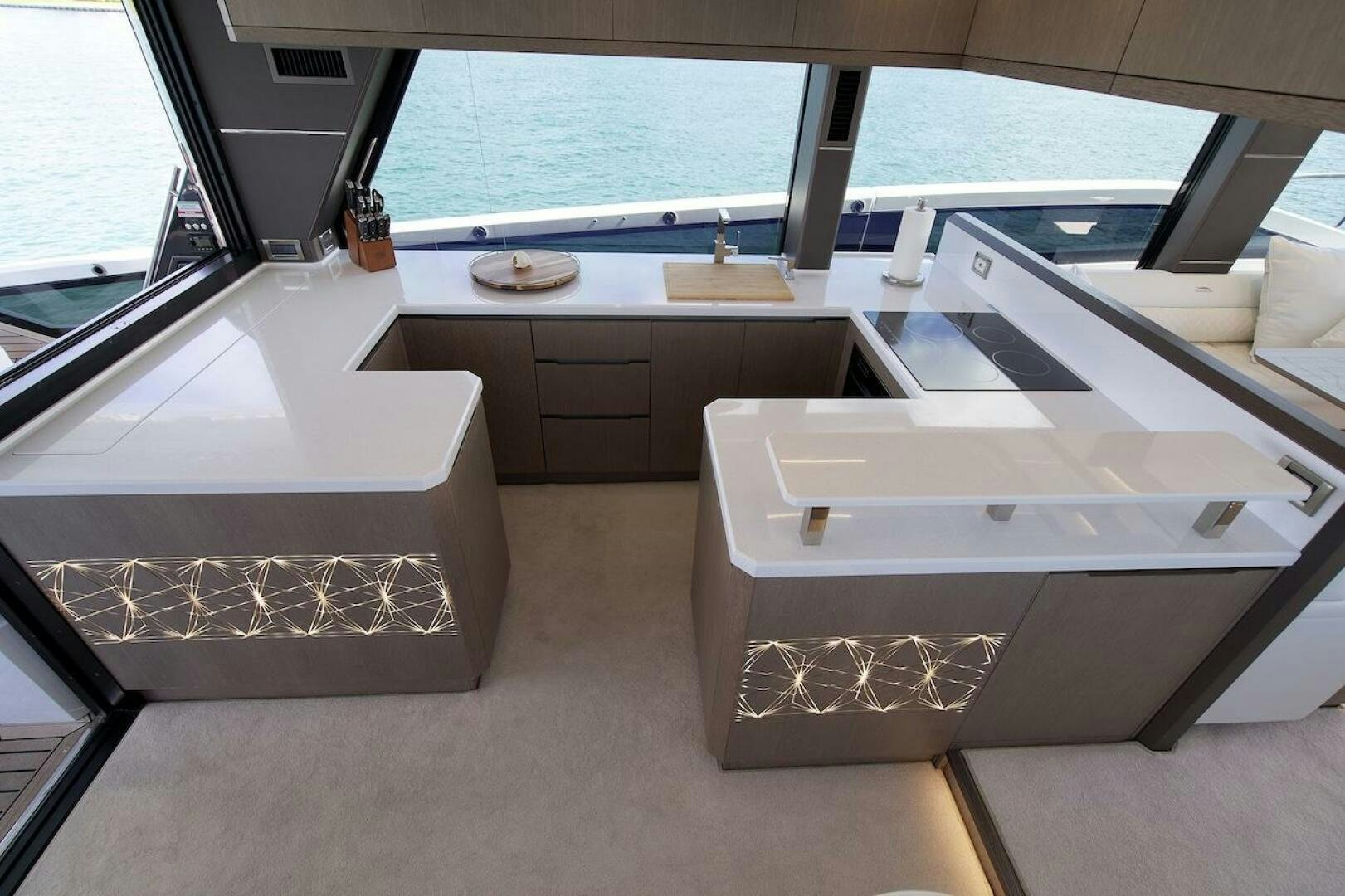 a kitchen with white counter tops aboard OUR NEXT CHAPTER Yacht for Sale