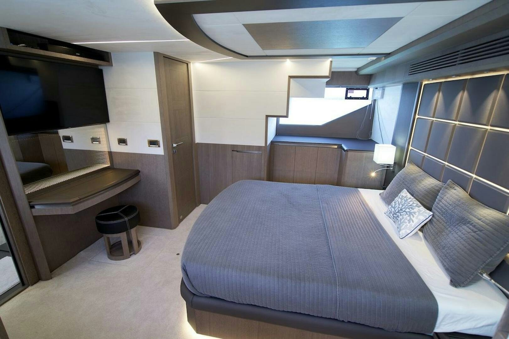 a room with a bed and a desk aboard OUR NEXT CHAPTER Yacht for Sale