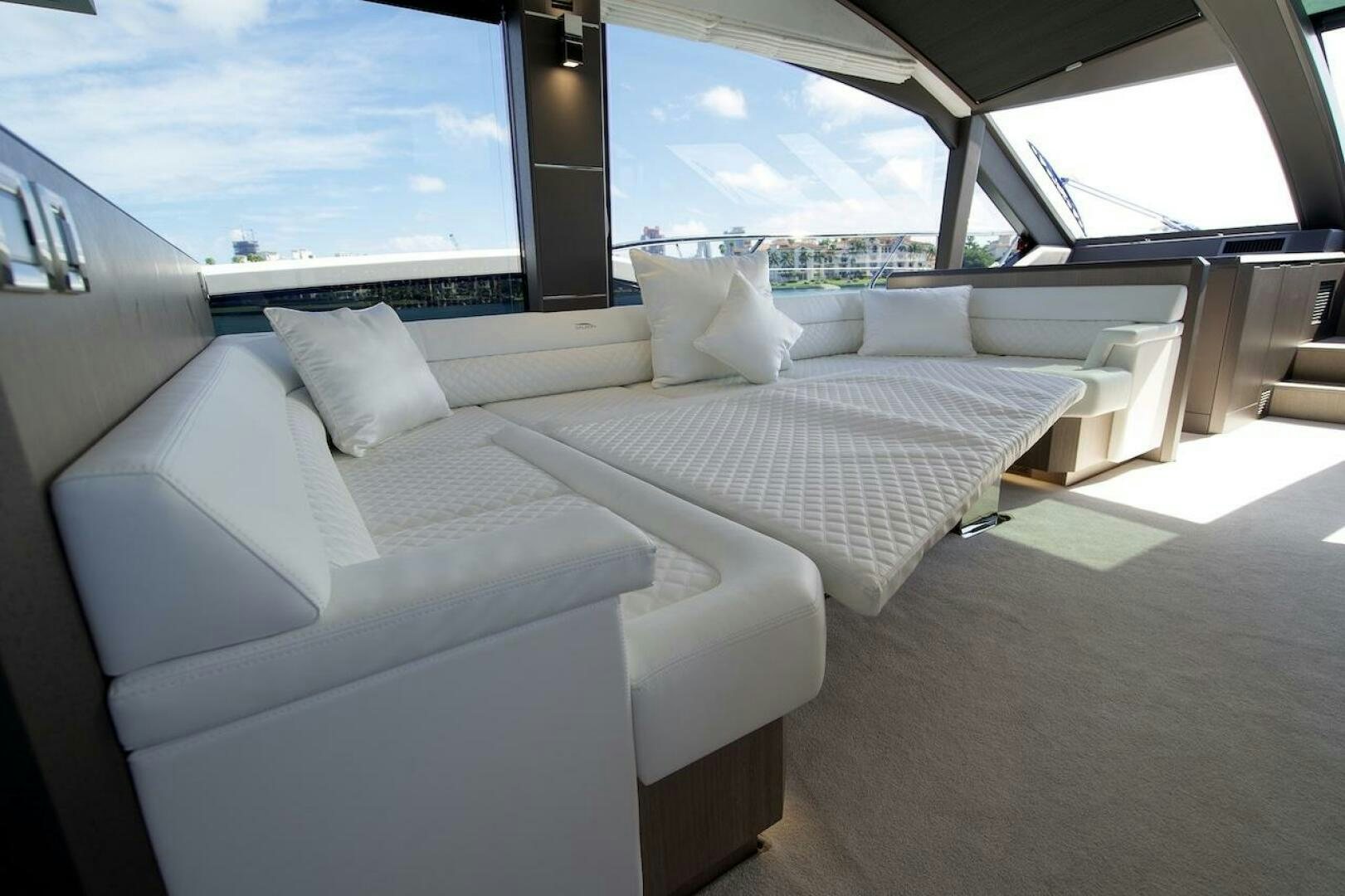 a room with couches and a window aboard OUR NEXT CHAPTER Yacht for Sale