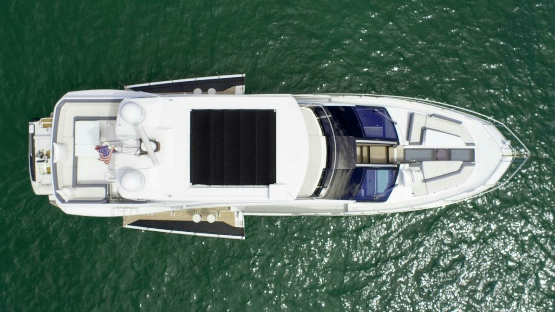 a white and black object on grass aboard OUR NEXT CHAPTER Yacht for Sale