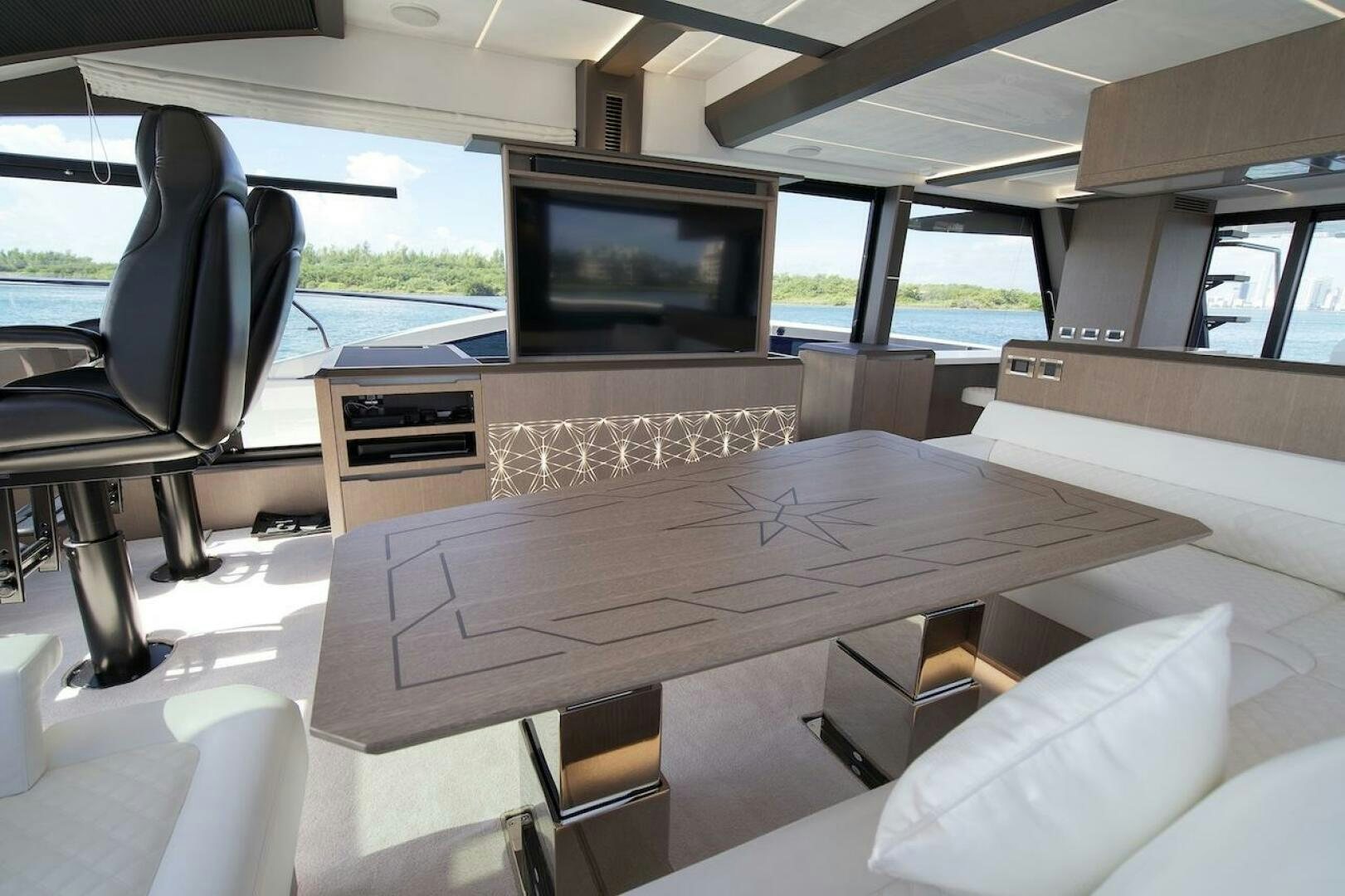 a room with a table and chairs aboard OUR NEXT CHAPTER Yacht for Sale