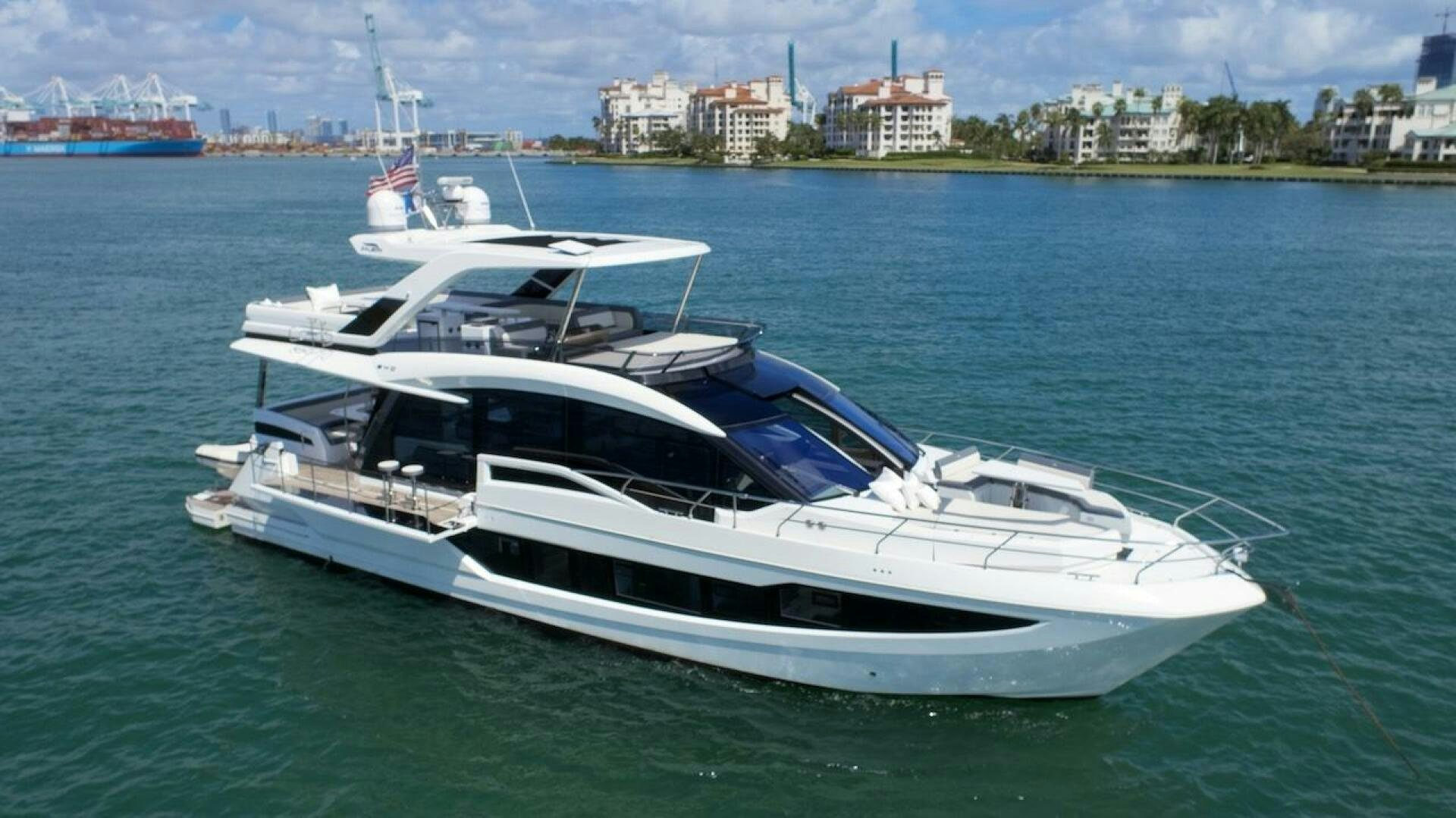 a white yacht on the water aboard OUR NEXT CHAPTER Yacht for Sale