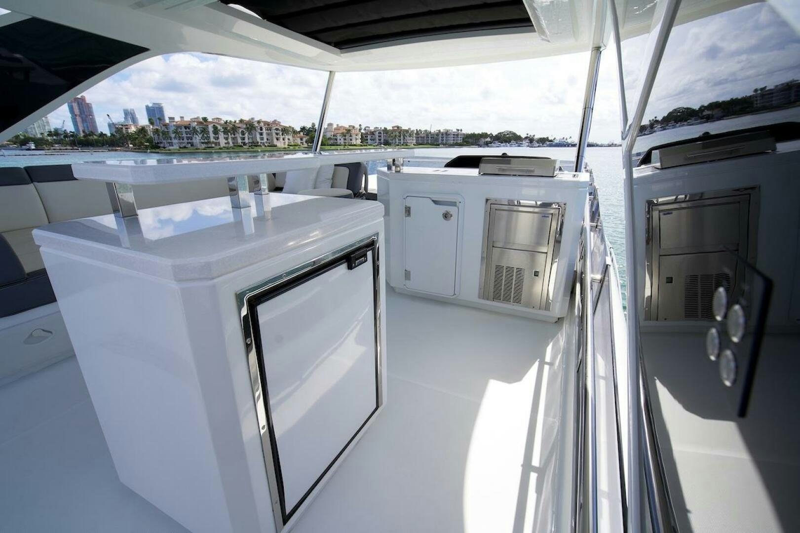 a large kitchen with white cabinets aboard OUR NEXT CHAPTER Yacht for Sale