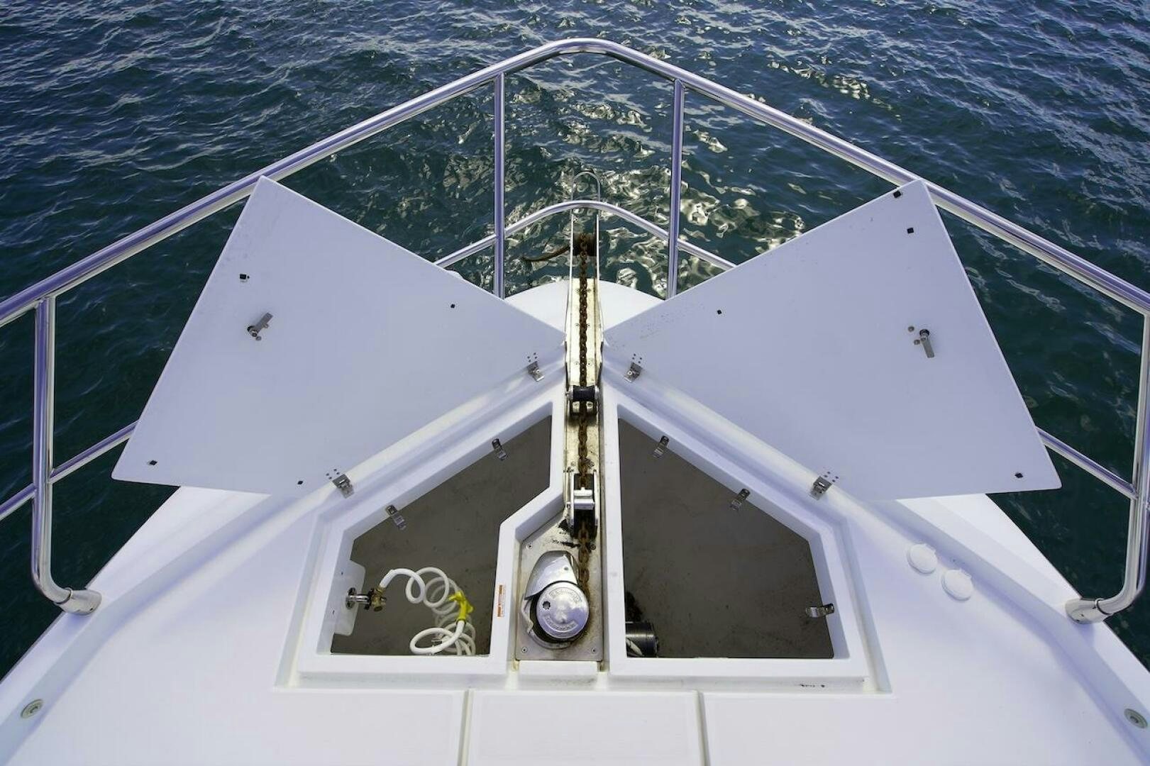 a white boat with a metal frame aboard OUR NEXT CHAPTER Yacht for Sale