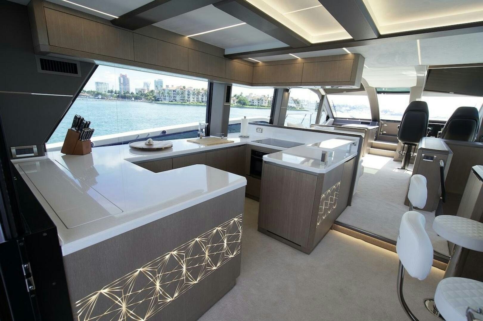 a room with a large window and a view of the water aboard OUR NEXT CHAPTER Yacht for Sale