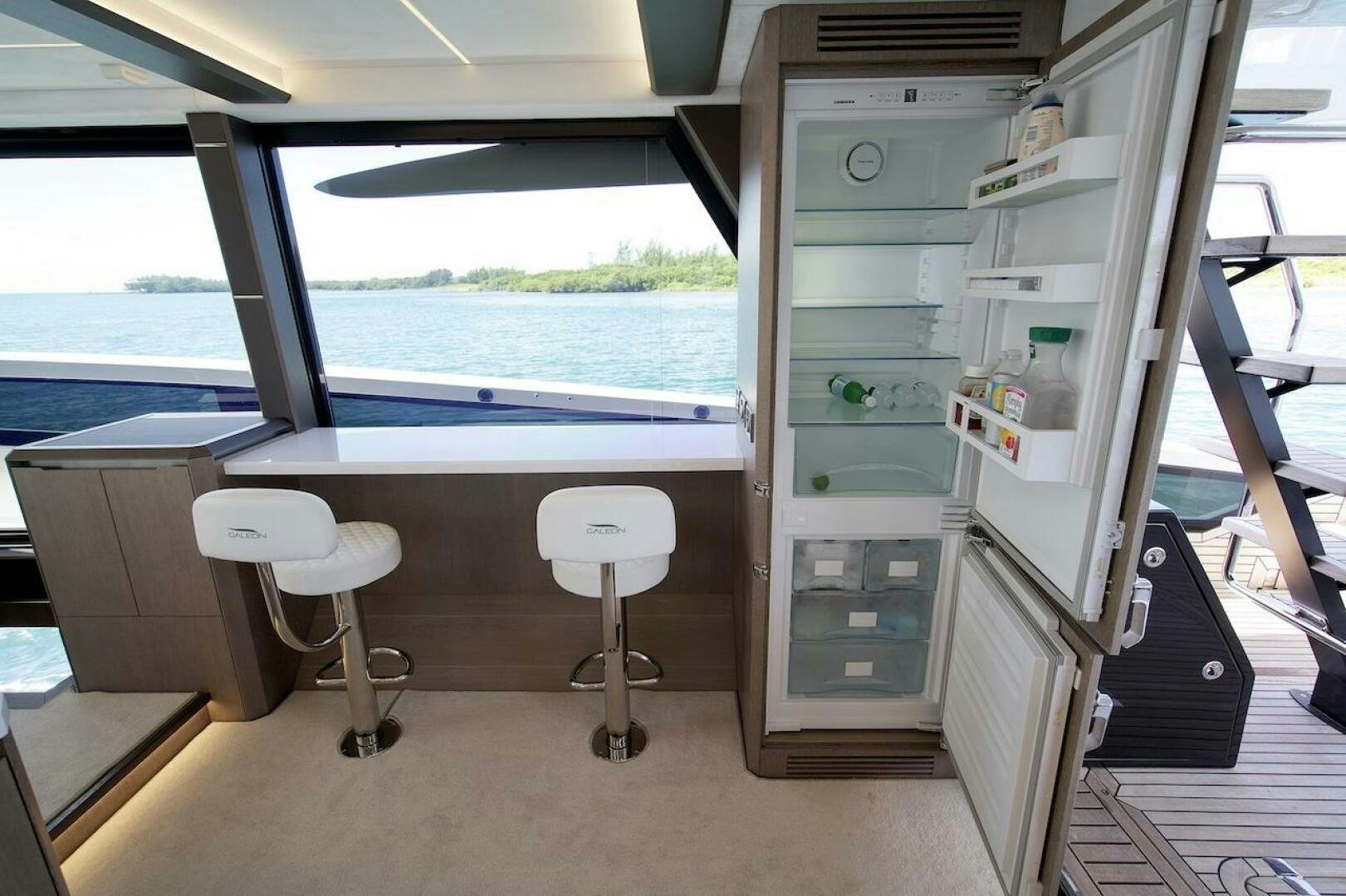 a refrigerator in a room aboard OUR NEXT CHAPTER Yacht for Sale
