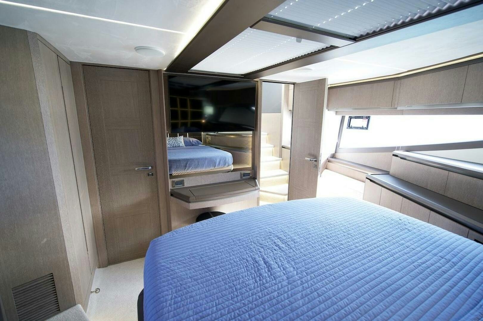 a room with a bed and a door aboard OUR NEXT CHAPTER Yacht for Sale