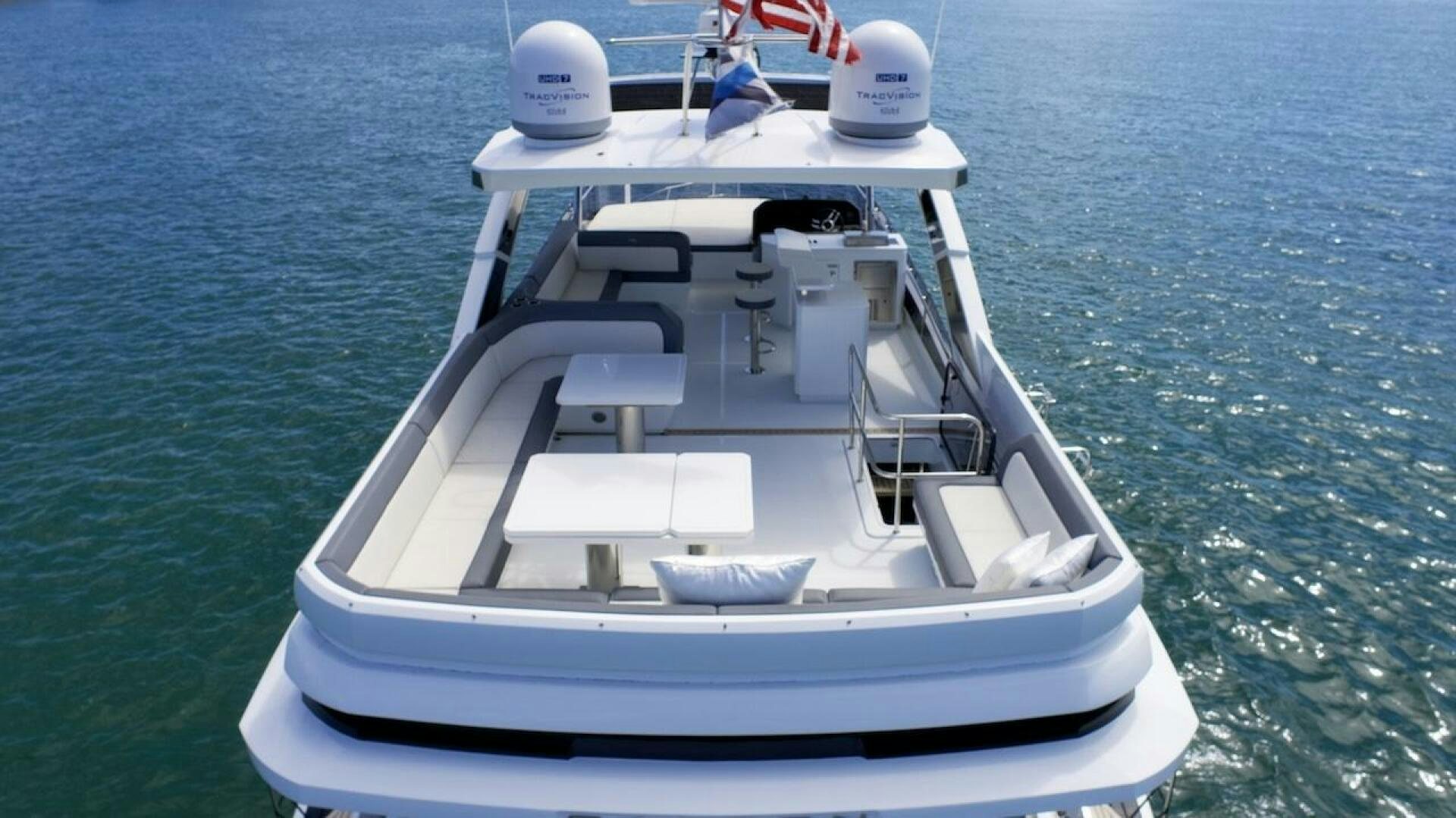a white boat on the water aboard OUR NEXT CHAPTER Yacht for Sale