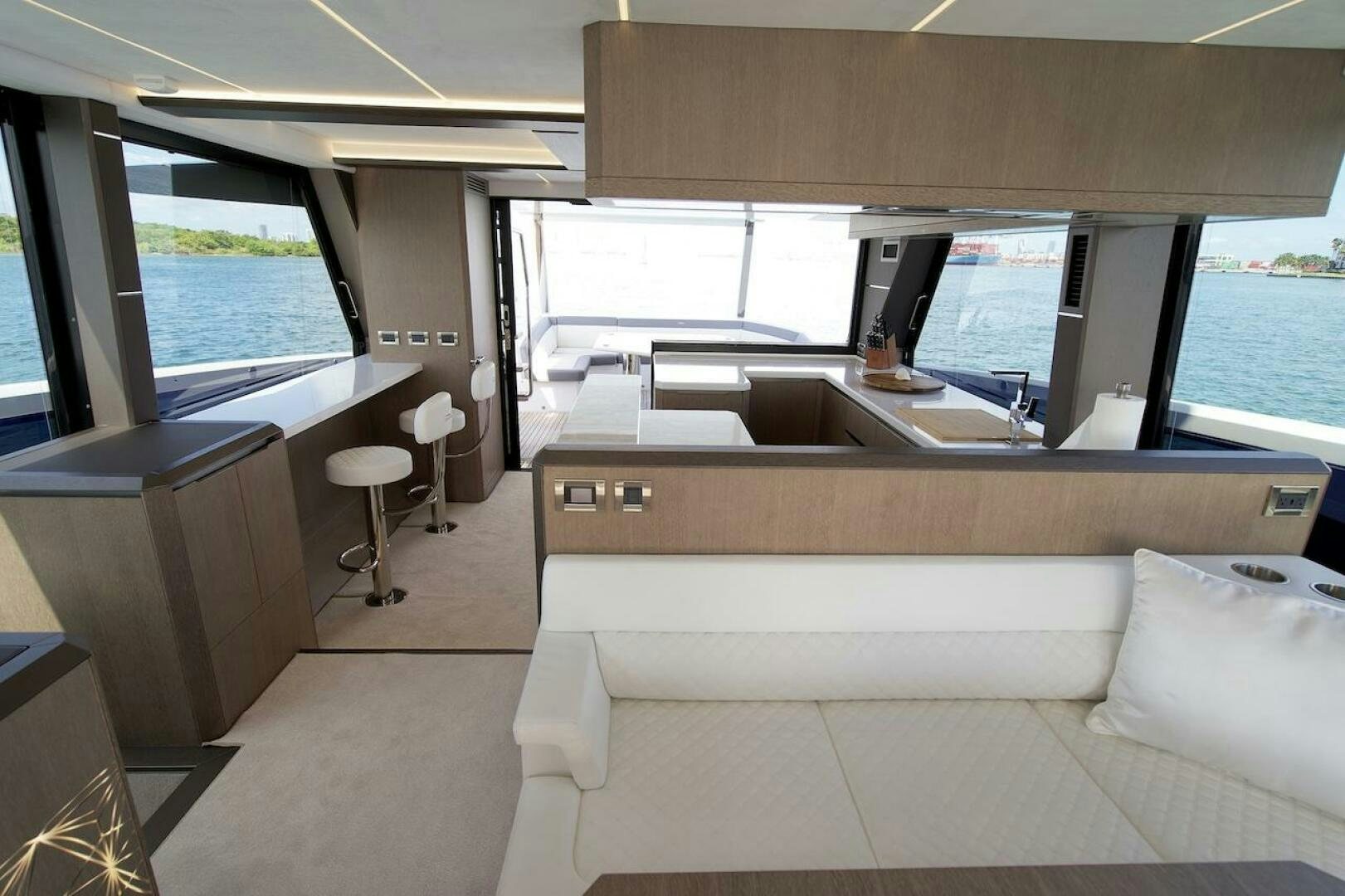 a room with a couch and a table aboard OUR NEXT CHAPTER Yacht for Sale