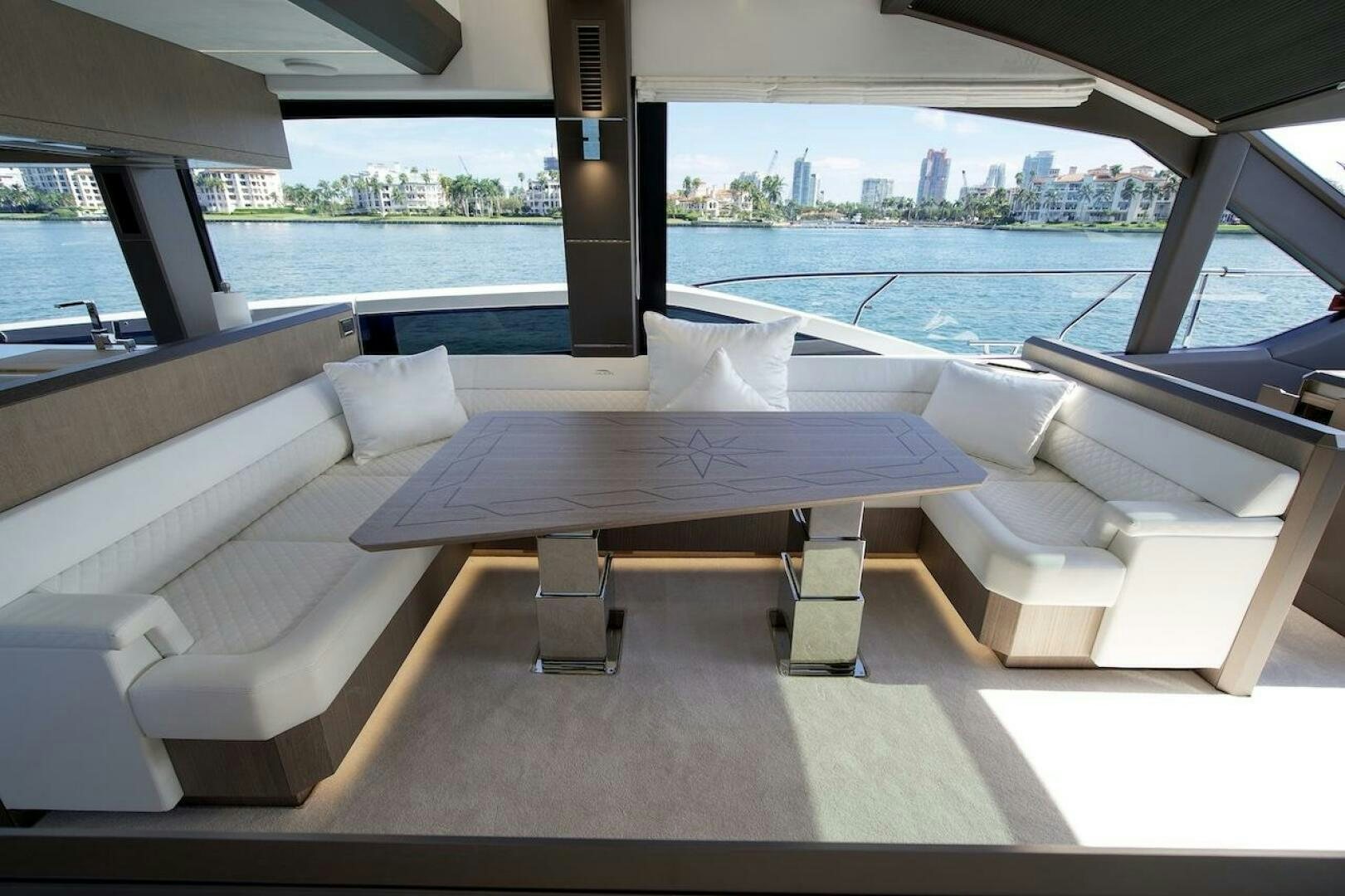 a room with a table and chairs aboard OUR NEXT CHAPTER Yacht for Sale