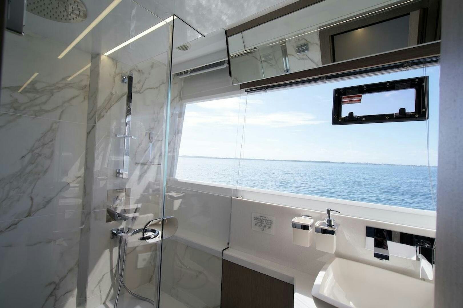 a bathroom with a glass shower aboard OUR NEXT CHAPTER Yacht for Sale