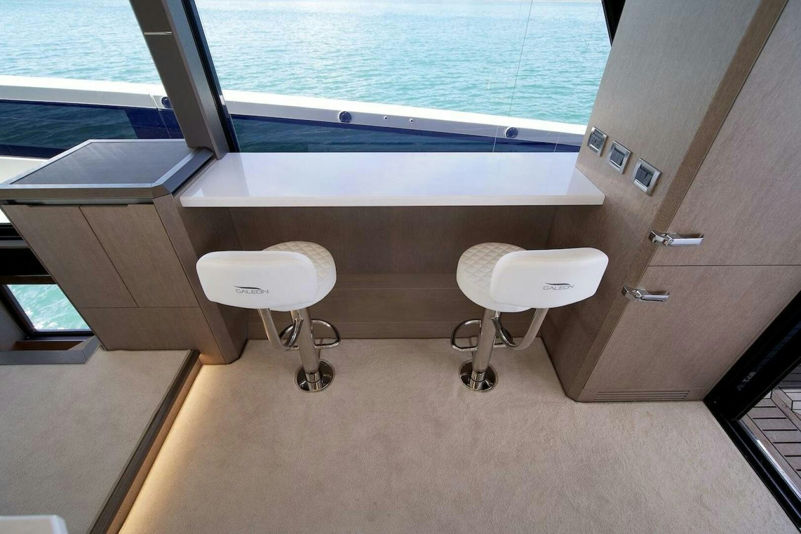 a room with a table and chairs aboard OUR NEXT CHAPTER Yacht for Sale