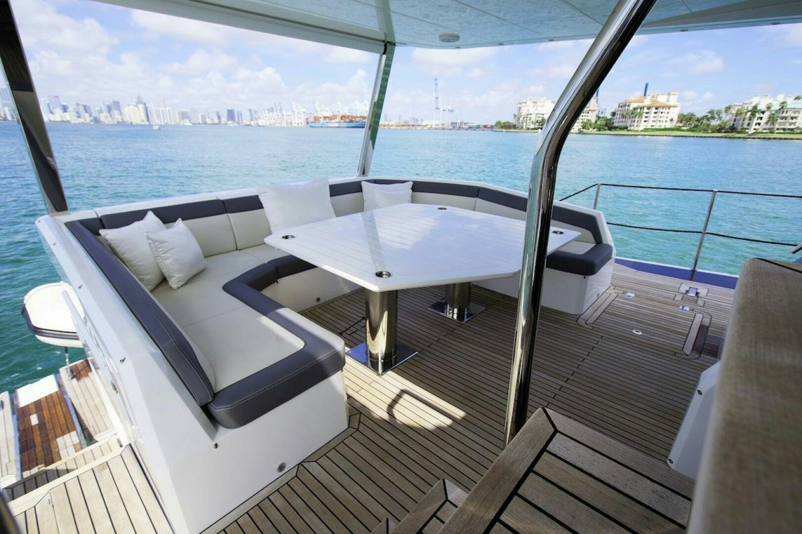 a balcony with a view of the city and water aboard OUR NEXT CHAPTER Yacht for Sale