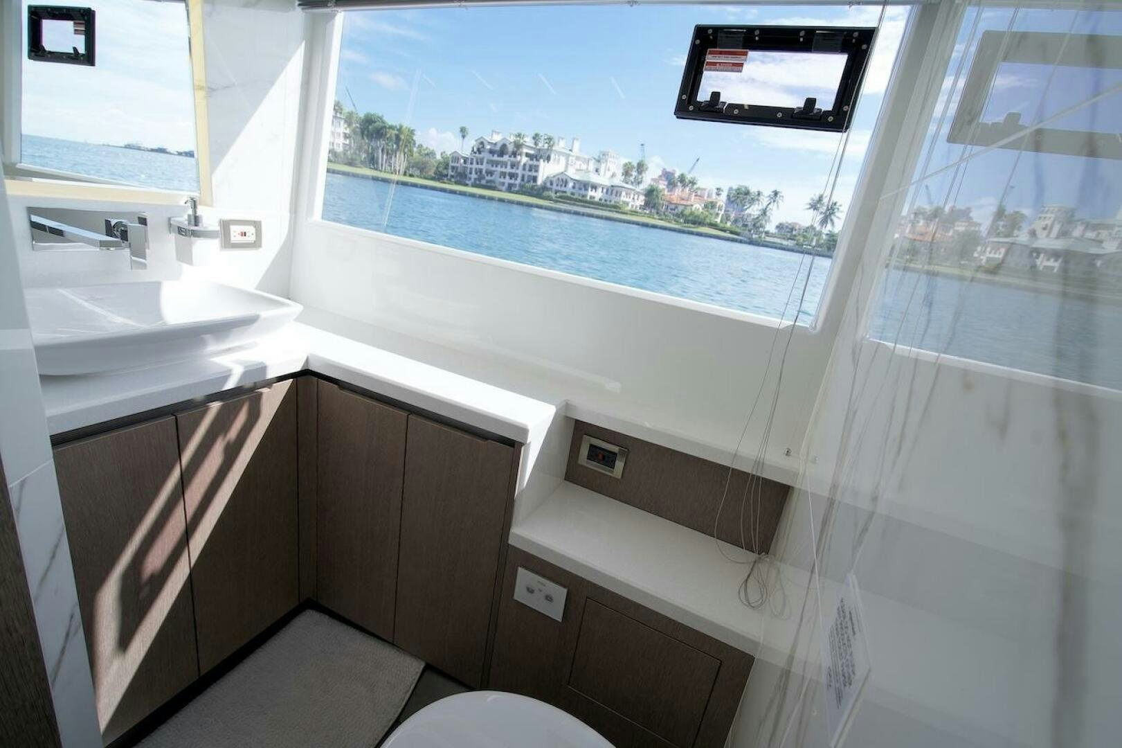 a bathroom with a window aboard OUR NEXT CHAPTER Yacht for Sale