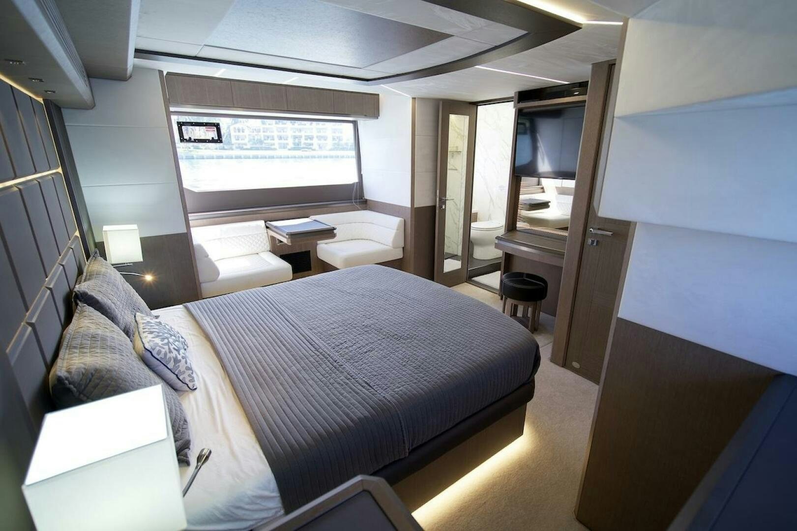 a room with a bed and a desk aboard OUR NEXT CHAPTER Yacht for Sale