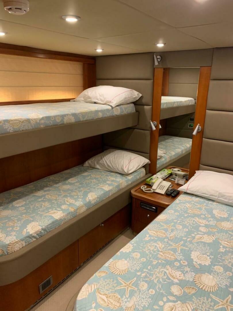 a couple of beds in a hotel room aboard JULCAN II Yacht for Sale