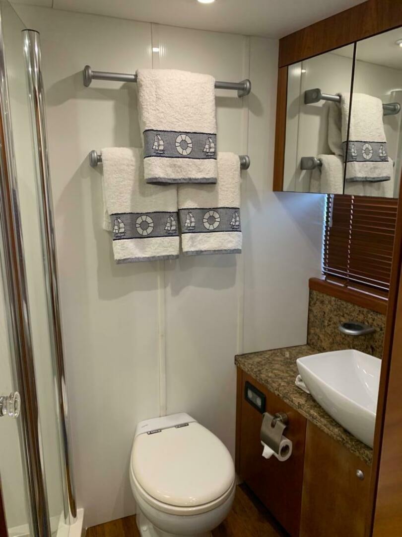 a bathroom with a sink and toilet aboard JULCAN II Yacht for Sale
