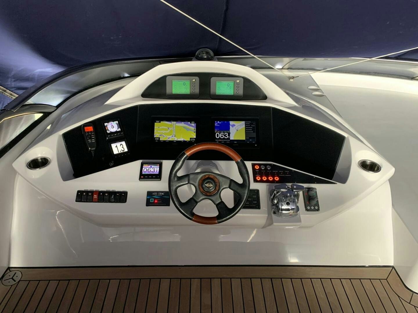 the inside of a white car aboard JULCAN II Yacht for Sale