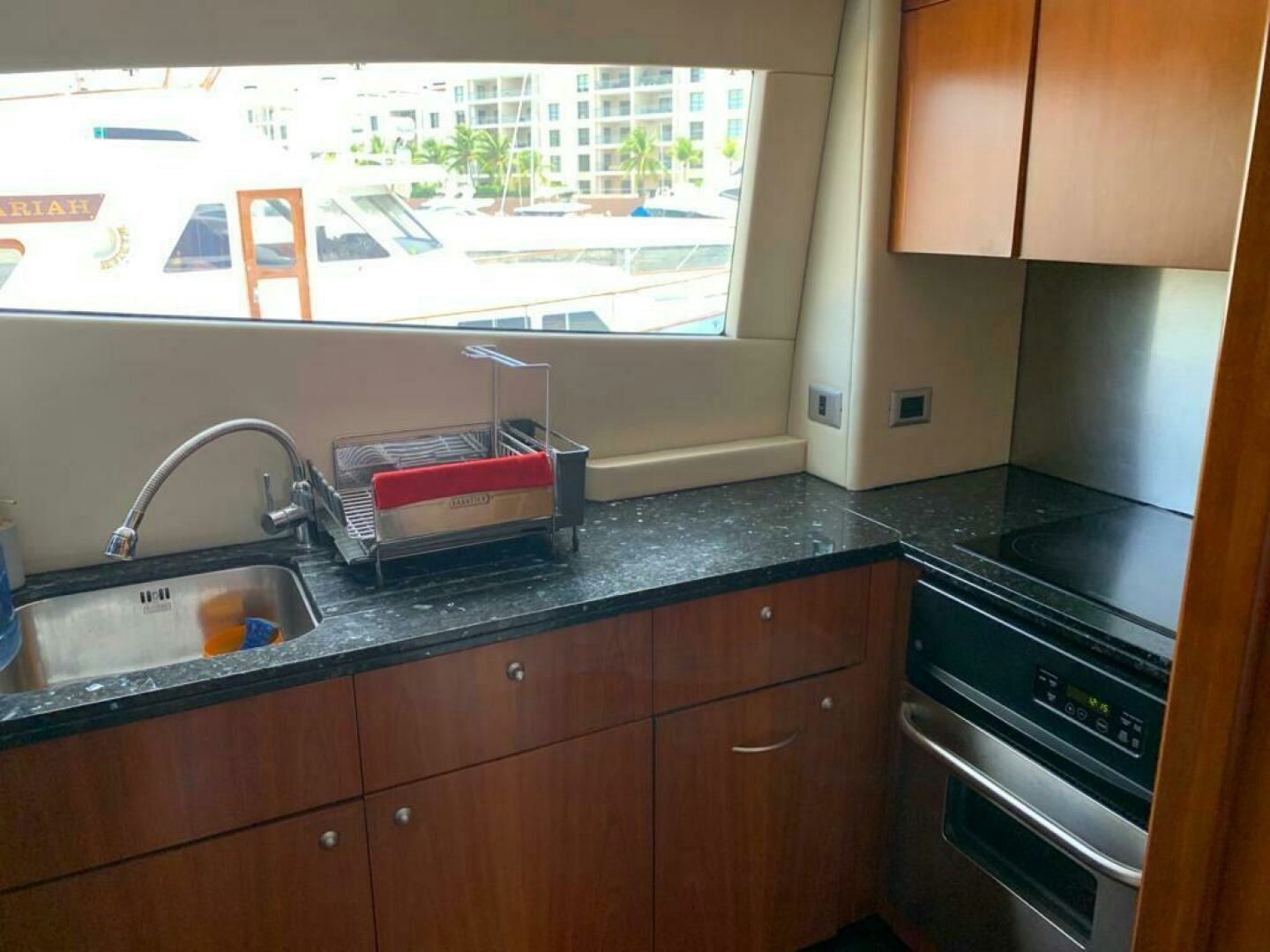 a kitchen with a sink and a window aboard JULCAN II Yacht for Sale