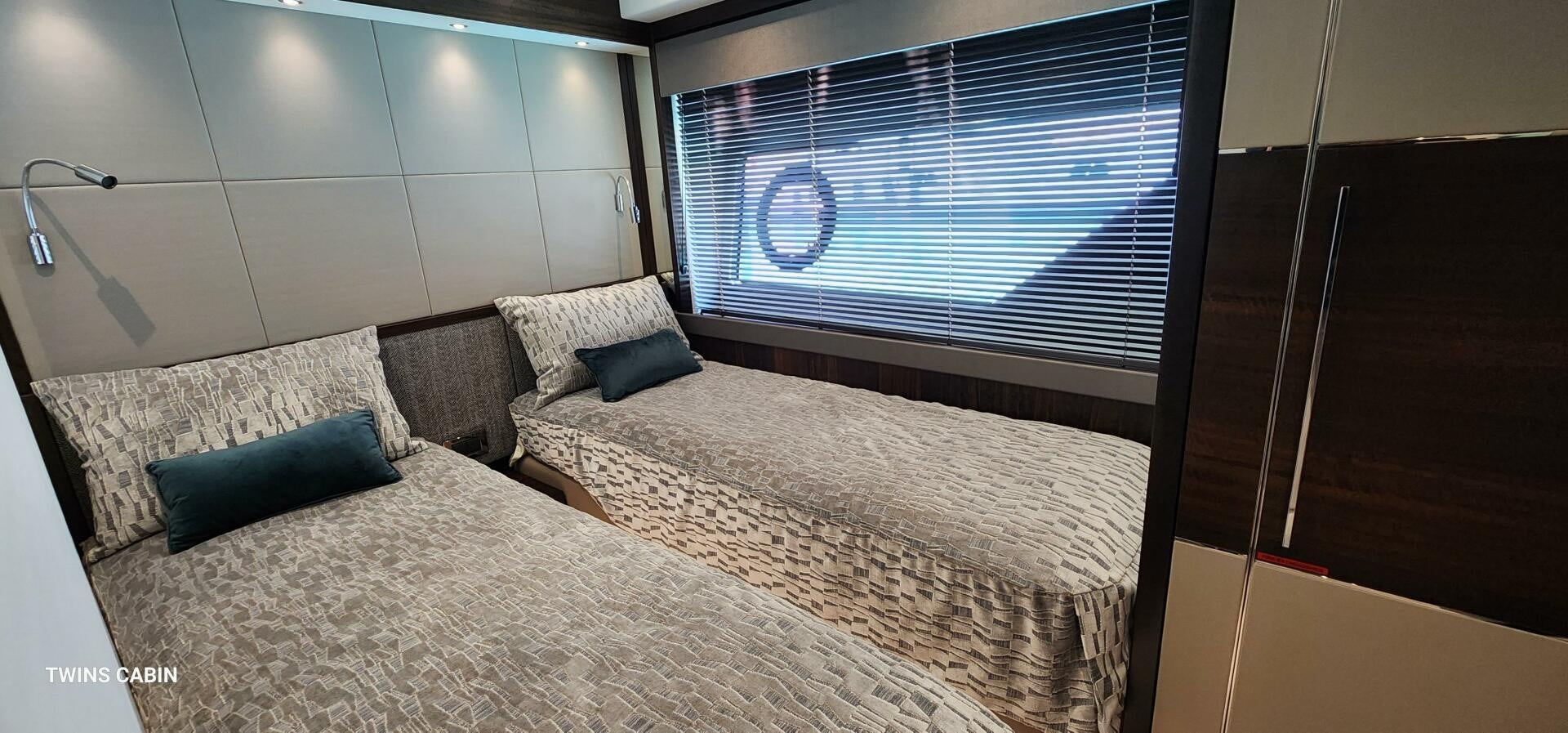 a room with a bed and a window aboard 5 MARES Yacht for Sale
