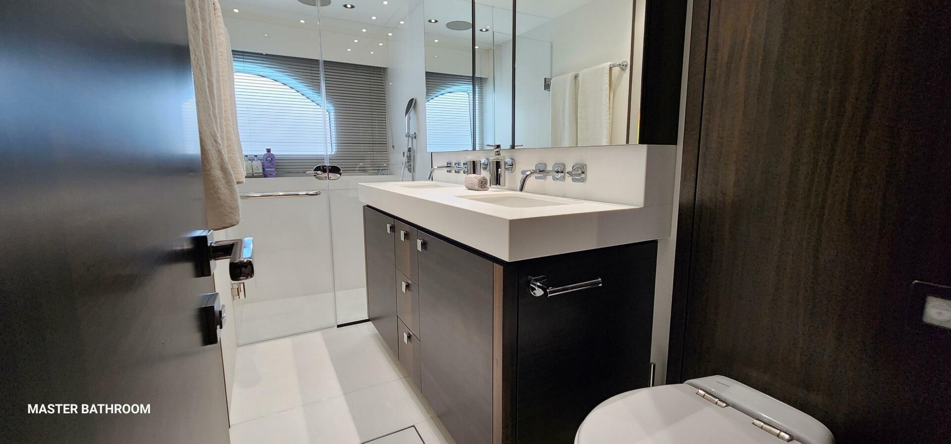 a bathroom with a sink and a mirror aboard 5 MARES Yacht for Sale