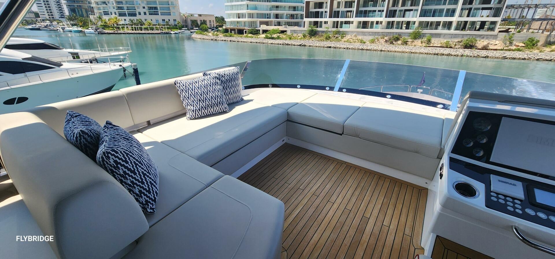 a deck with a couch and a pool aboard 5 MARES Yacht for Sale