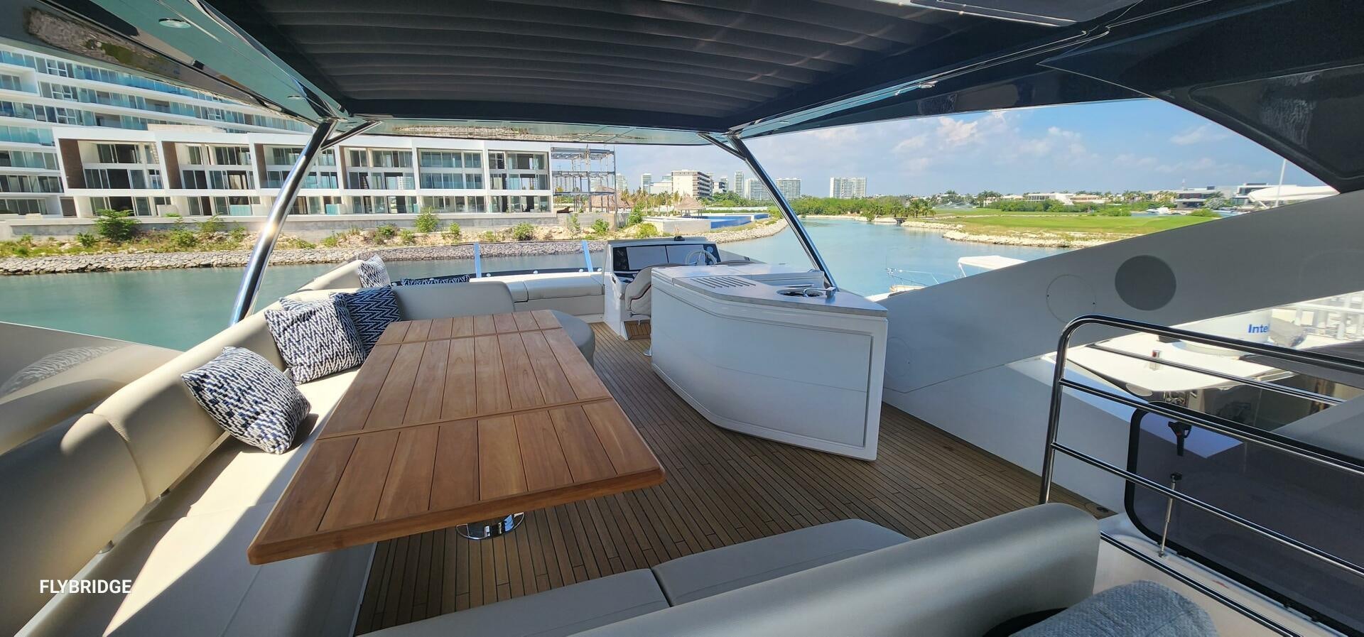 a deck with a view of a city and water aboard 5 MARES Yacht for Sale