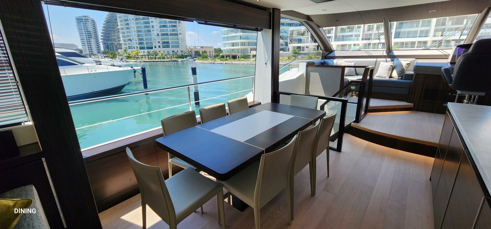a room with a table and chairs aboard 5 MARES Yacht for Sale