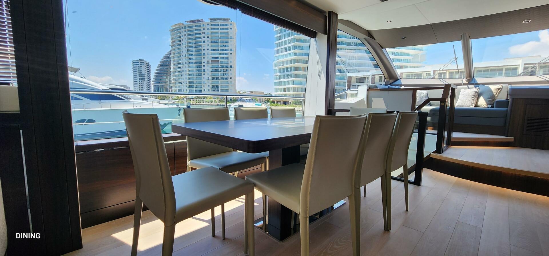 a room with a table and chairs aboard 5 MARES Yacht for Sale