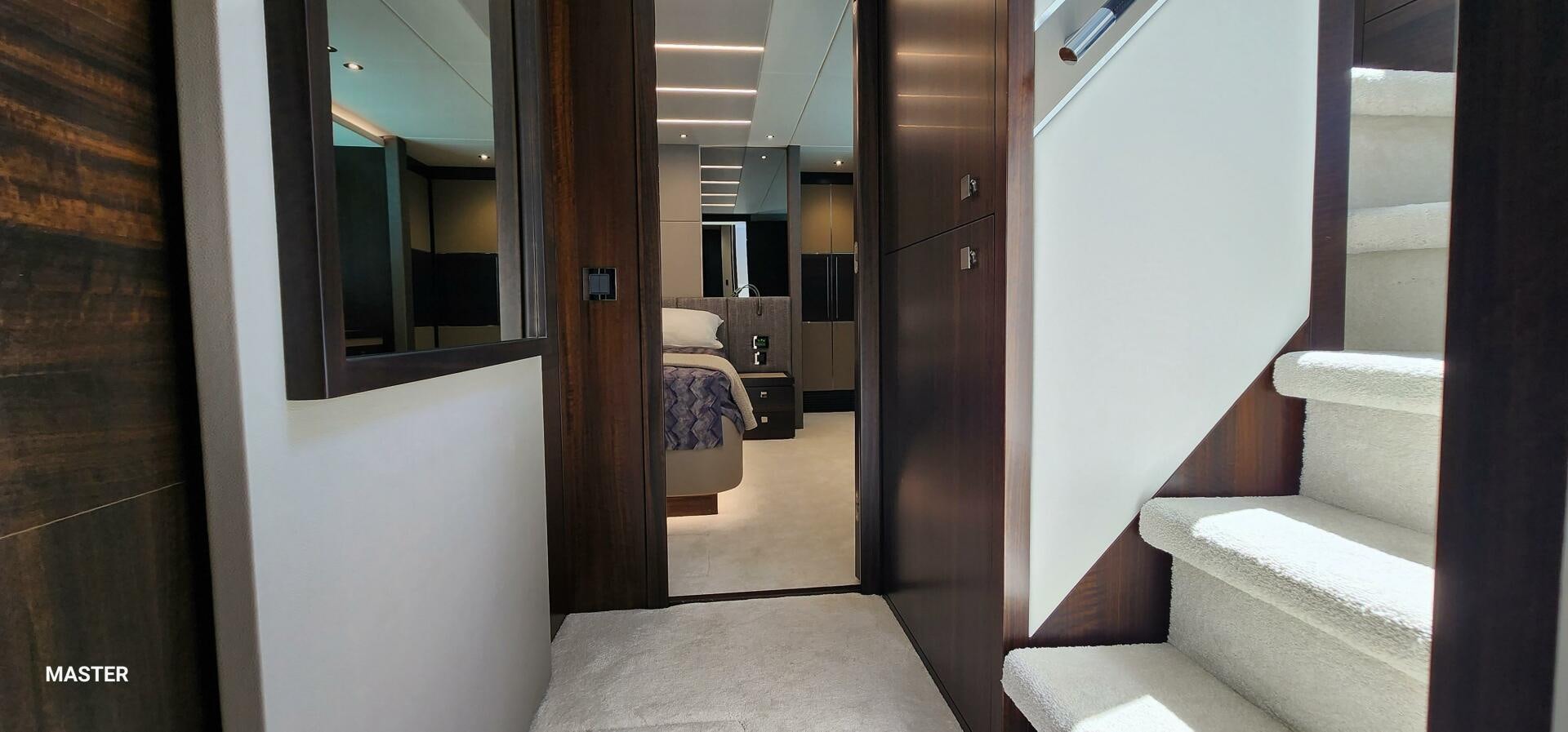 a room with a bed and a door aboard 5 MARES Yacht for Sale