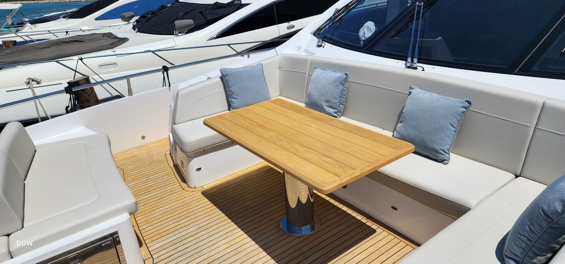 a boat with a table and chairs aboard 5 MARES Yacht for Sale