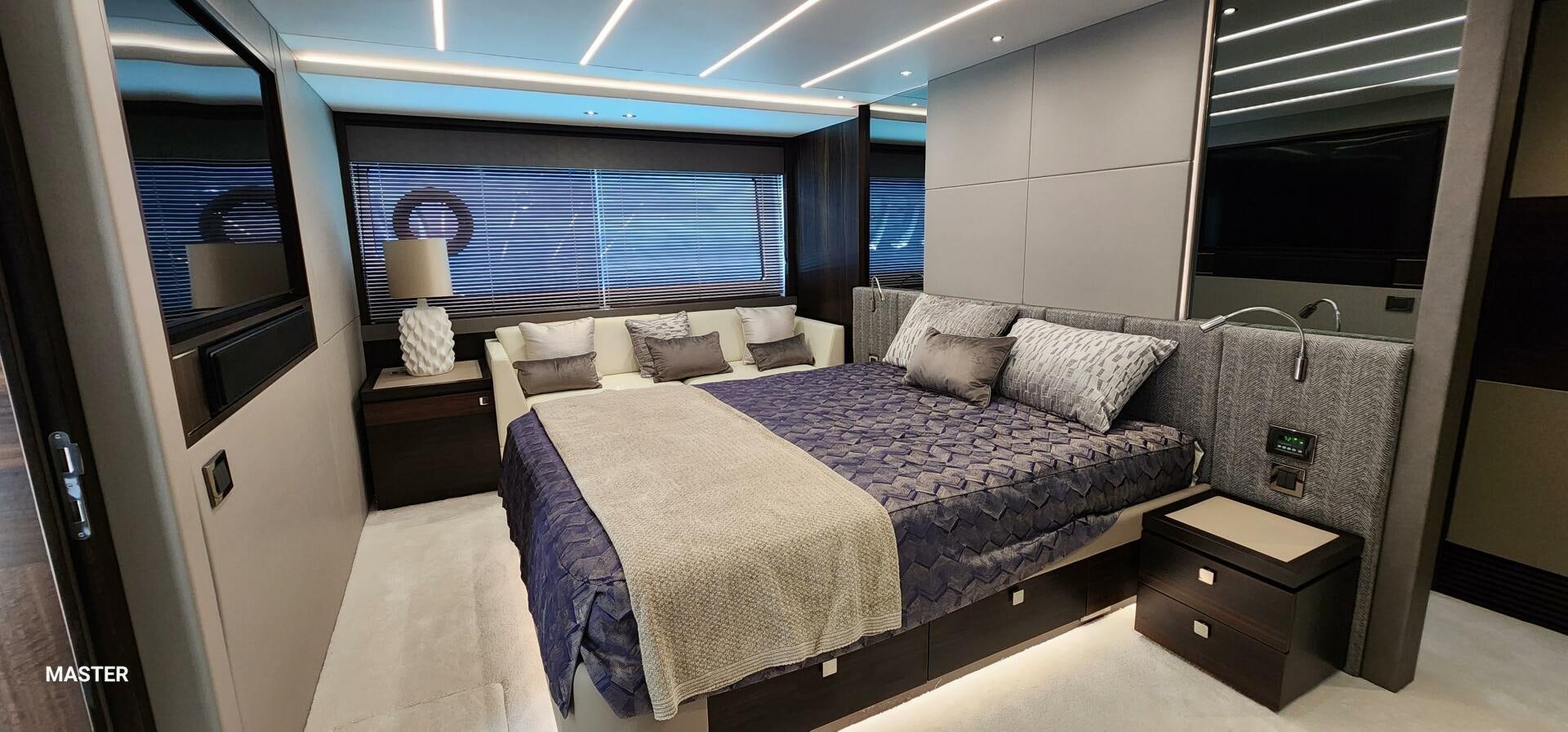 a room with a bed and a window aboard 5 MARES Yacht for Sale