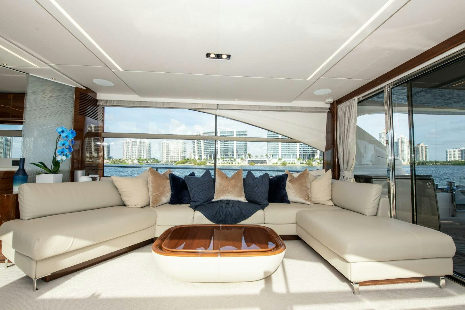 a living room with a large window aboard OUR ALEPH Yacht for Sale