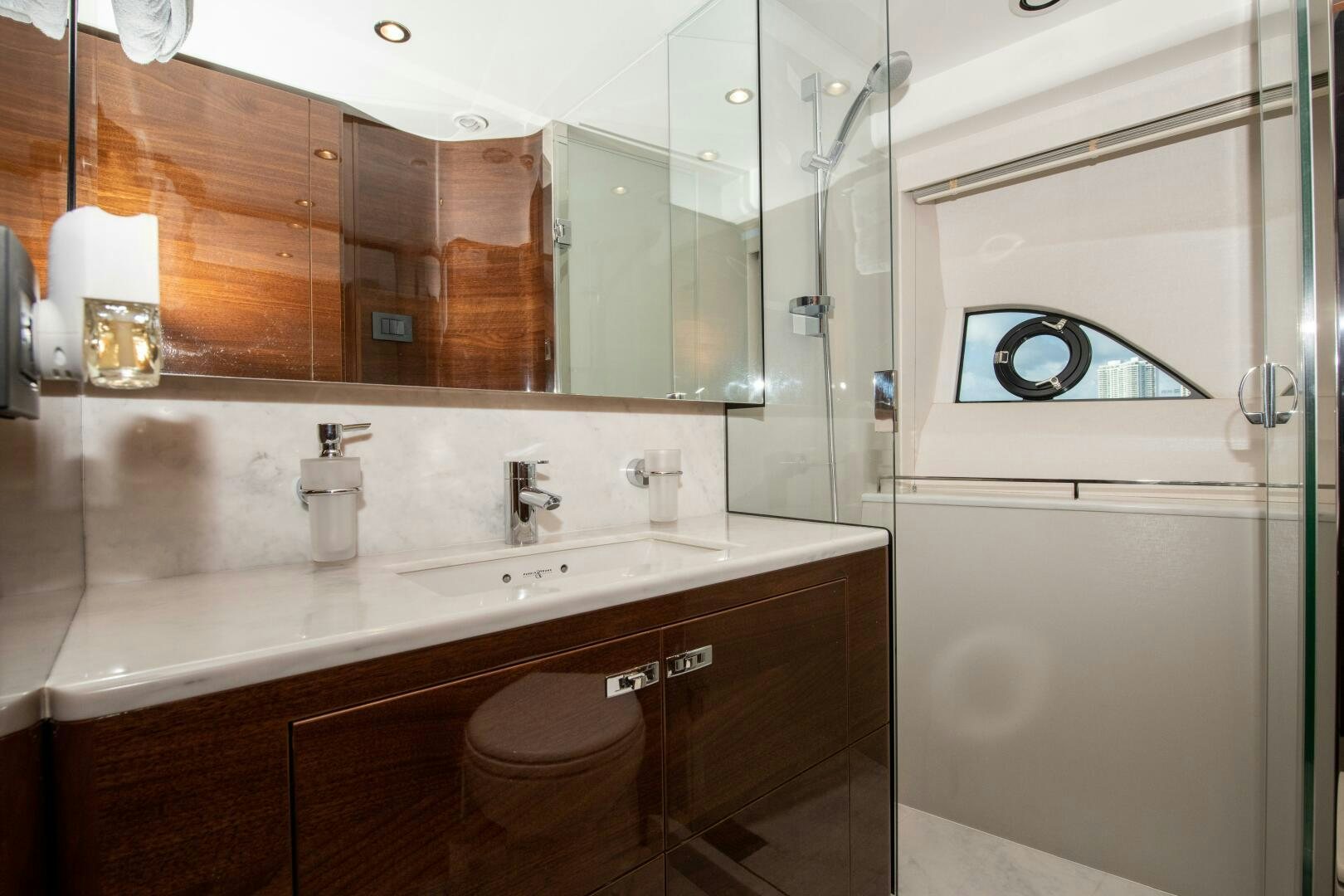 a bathroom with a large mirror aboard OUR ALEPH Yacht for Sale