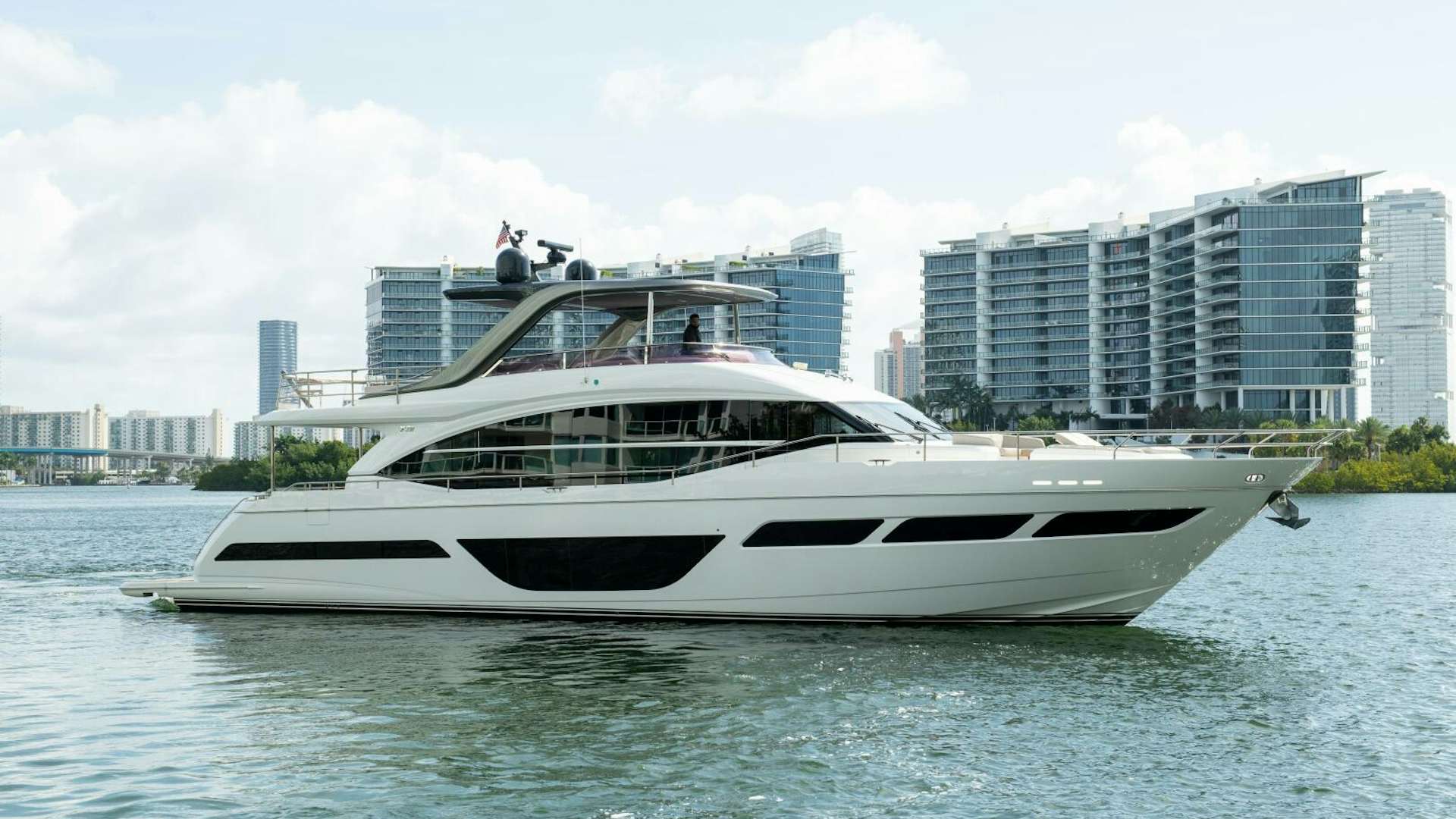 a white yacht in the water aboard OUR ALEPH Yacht for Sale