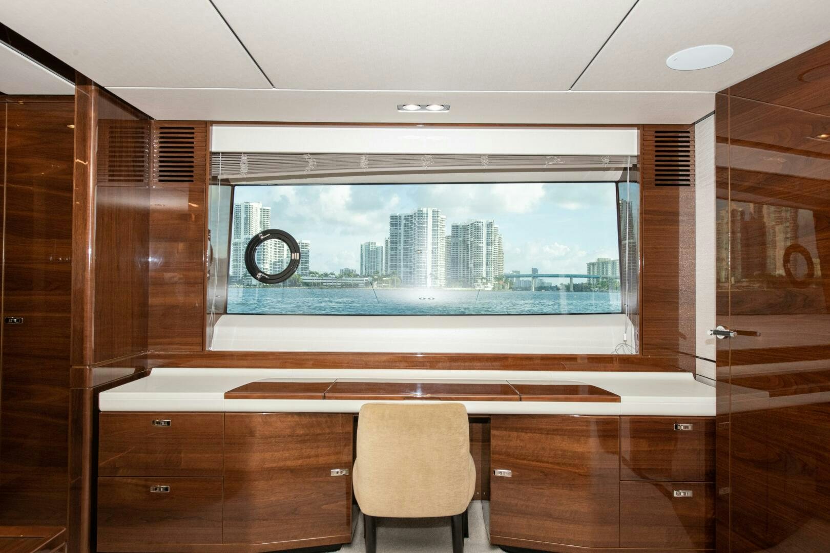 a room with a window and a table and chairs aboard OUR ALEPH Yacht for Sale