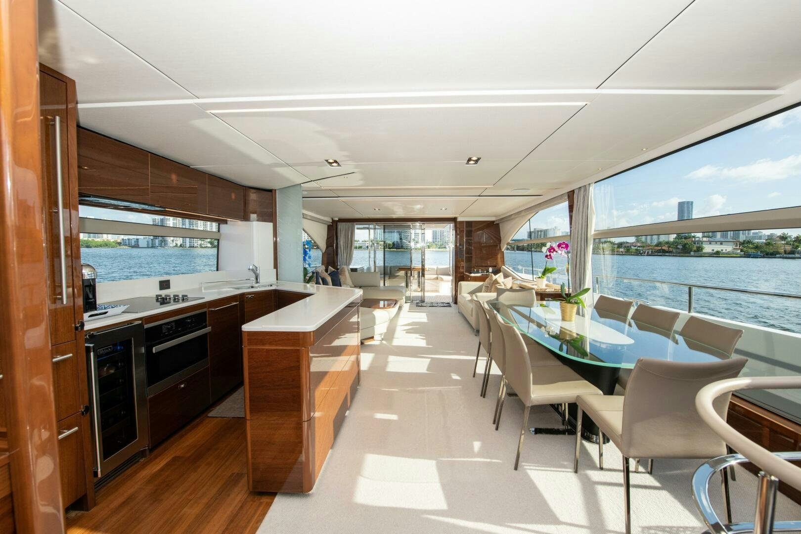 a room with a table chairs and a view of the city aboard OUR ALEPH Yacht for Sale