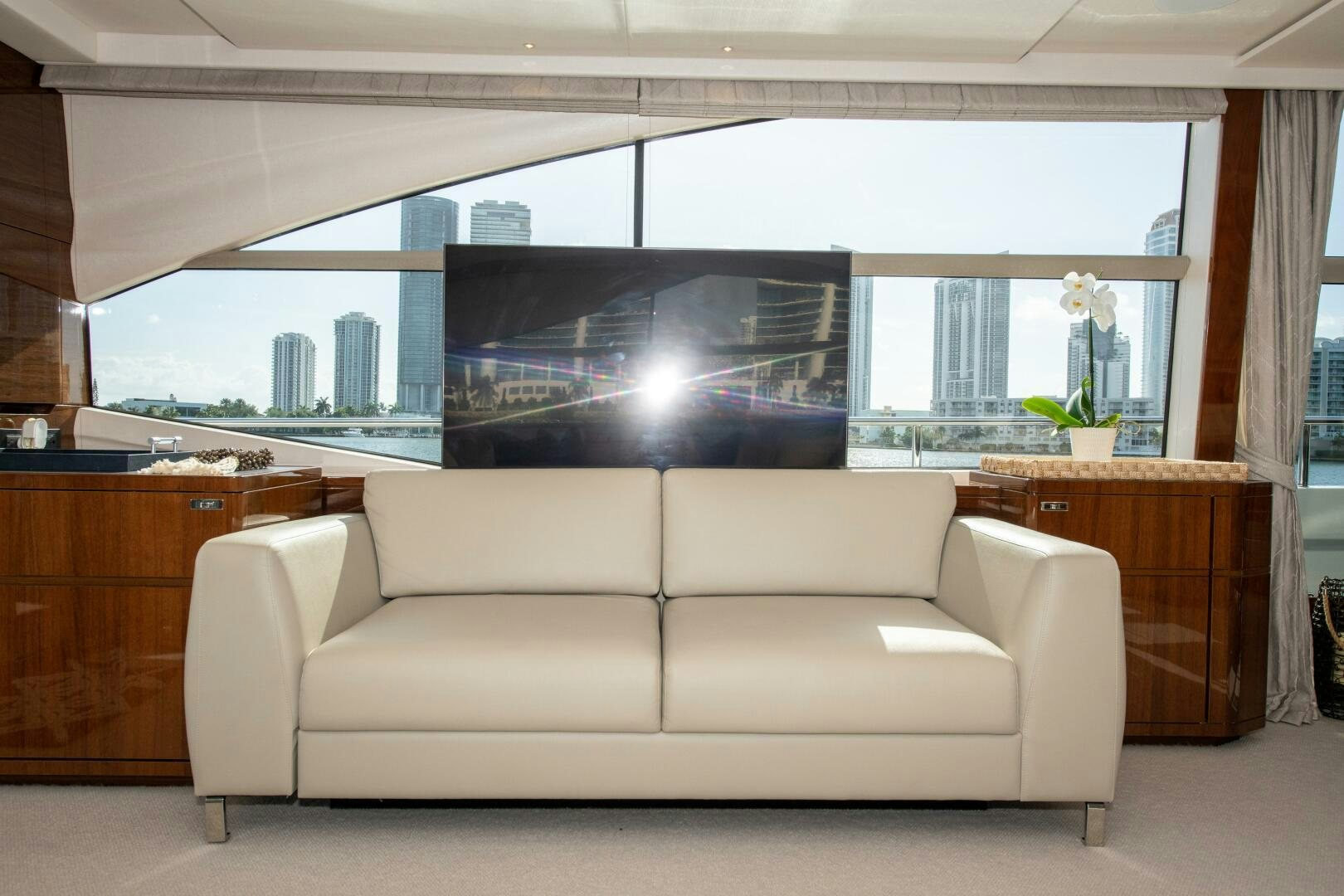 a white couch in a room aboard OUR ALEPH Yacht for Sale