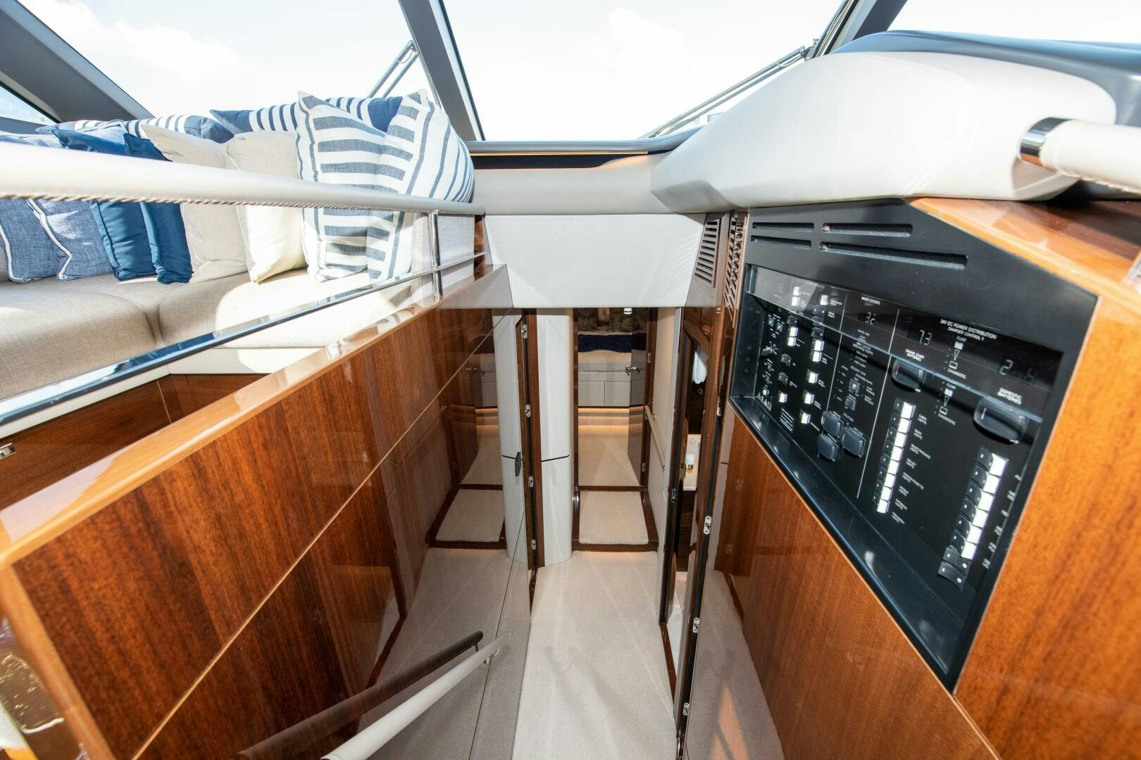 a black electronic device on a wooden table aboard OUR ALEPH Yacht for Sale