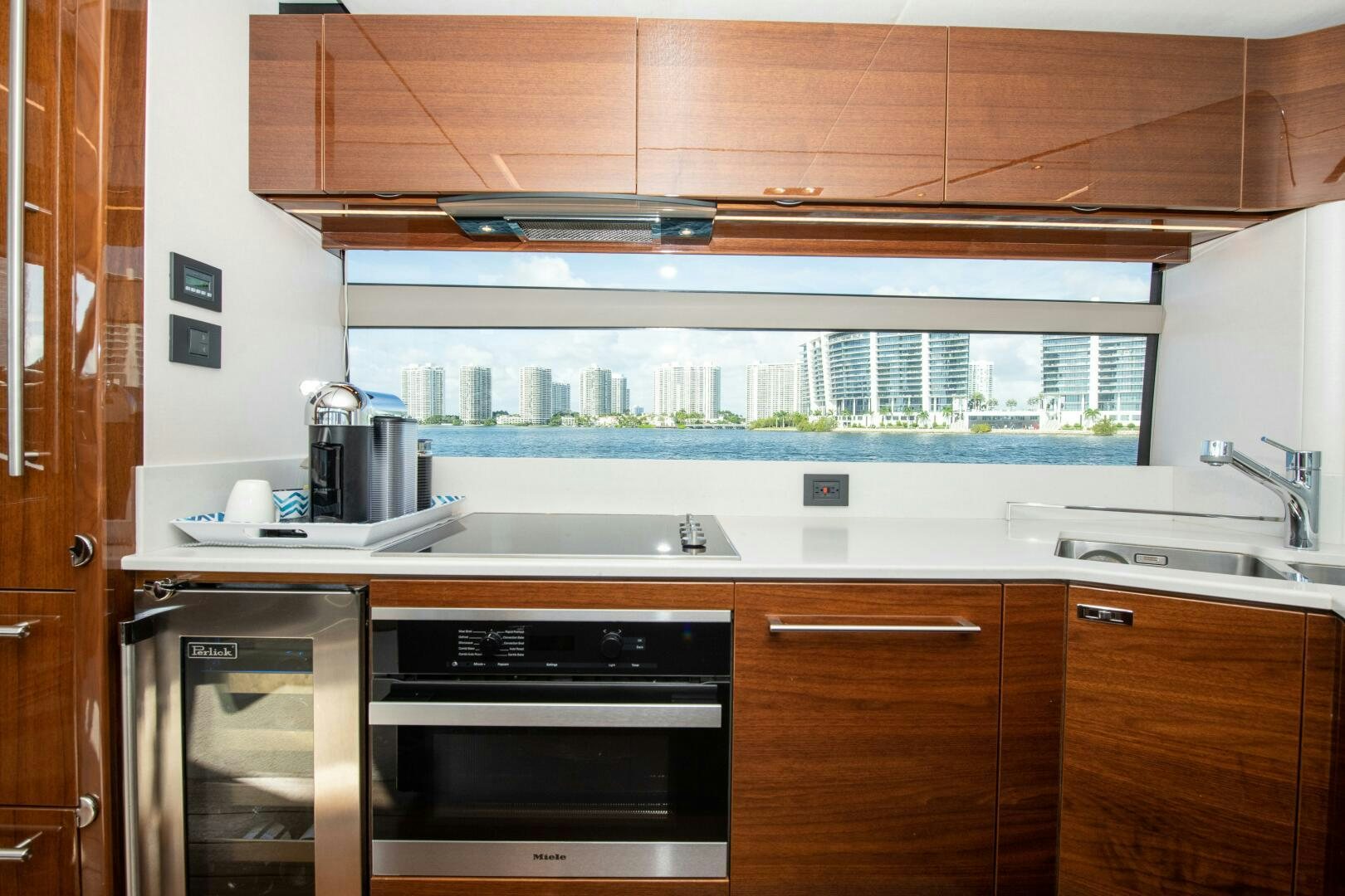 a kitchen with wooden cabinets aboard OUR ALEPH Yacht for Sale