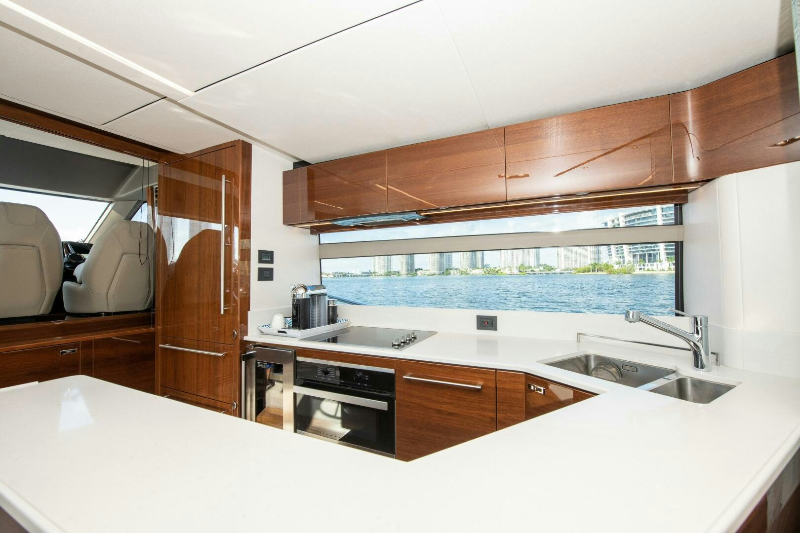 a kitchen with a large window aboard OUR ALEPH Yacht for Sale