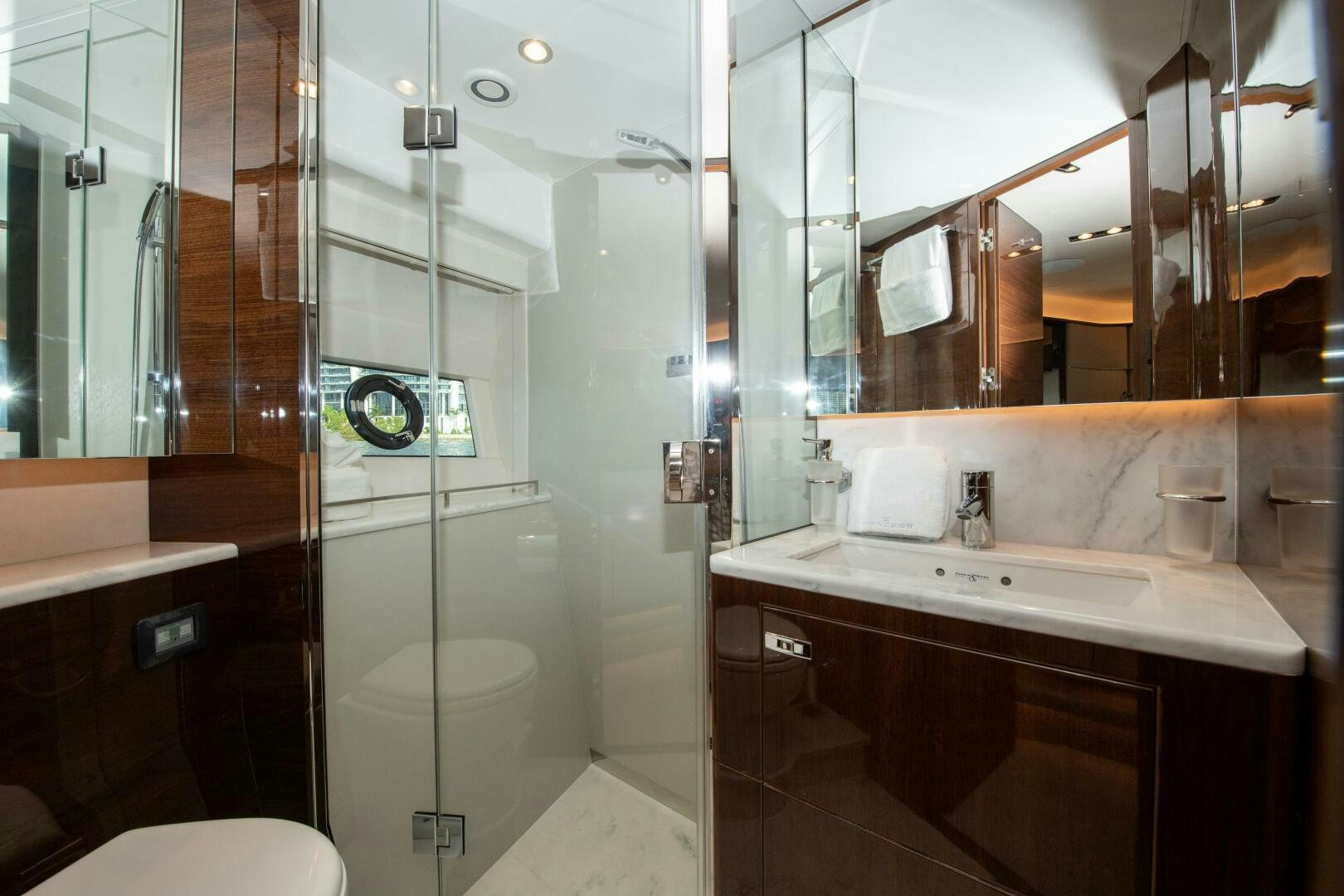 a bathroom with a glass shower aboard OUR ALEPH Yacht for Sale