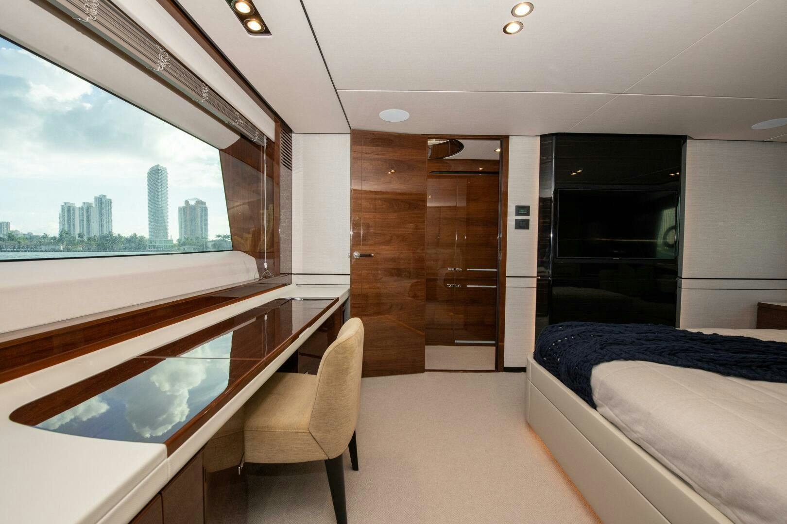 a room with a bed and a window aboard OUR ALEPH Yacht for Sale