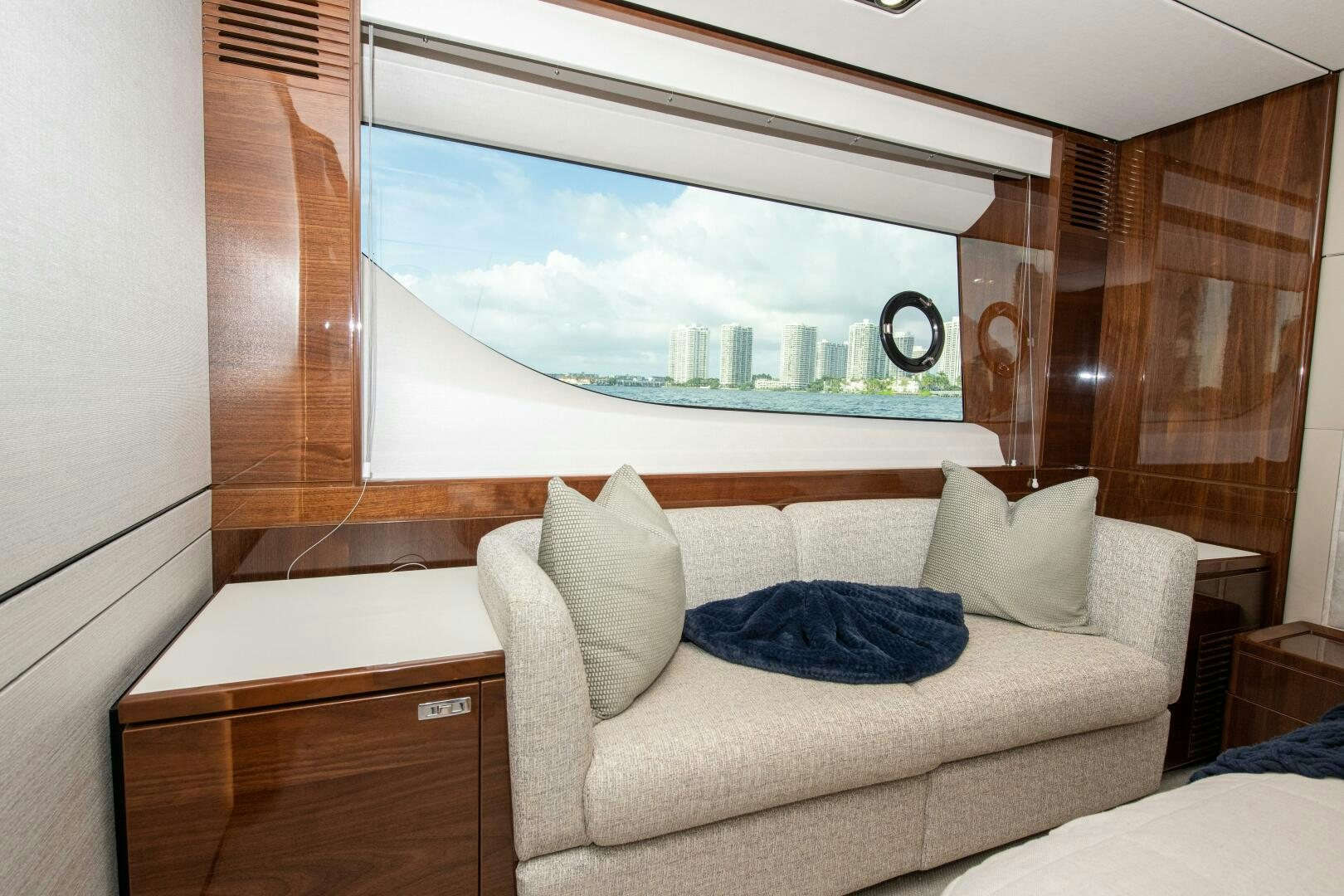 a room with a couch and a window aboard OUR ALEPH Yacht for Sale