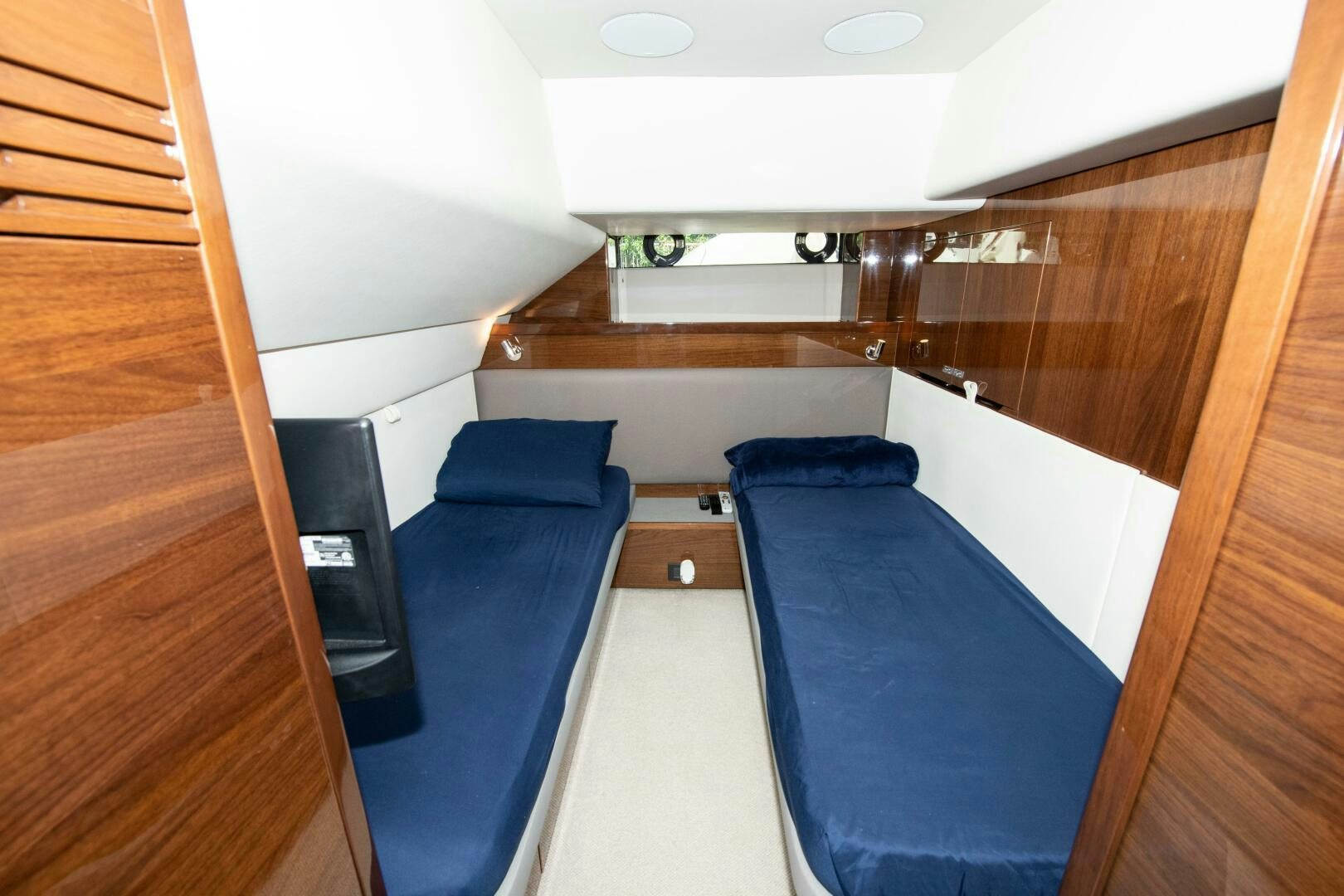 a room with a bed and a desk aboard OUR ALEPH Yacht for Sale