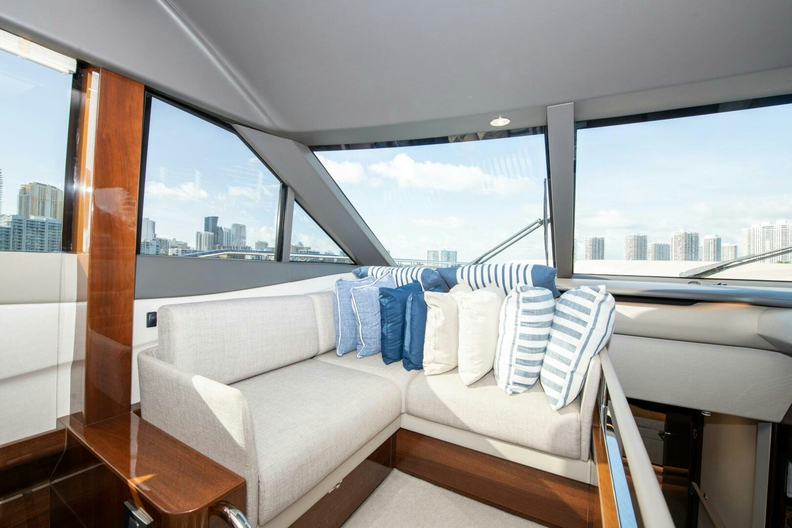 a room with a couch and a window aboard OUR ALEPH Yacht for Sale