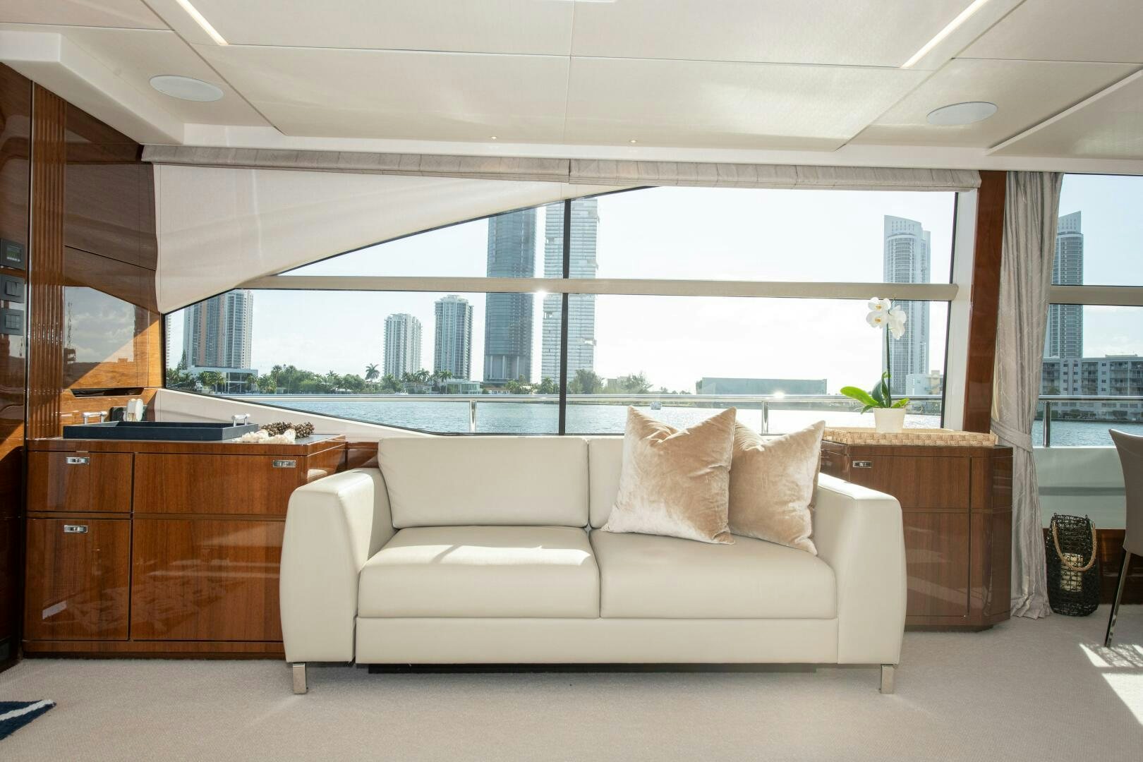 a white couch in a room aboard OUR ALEPH Yacht for Sale