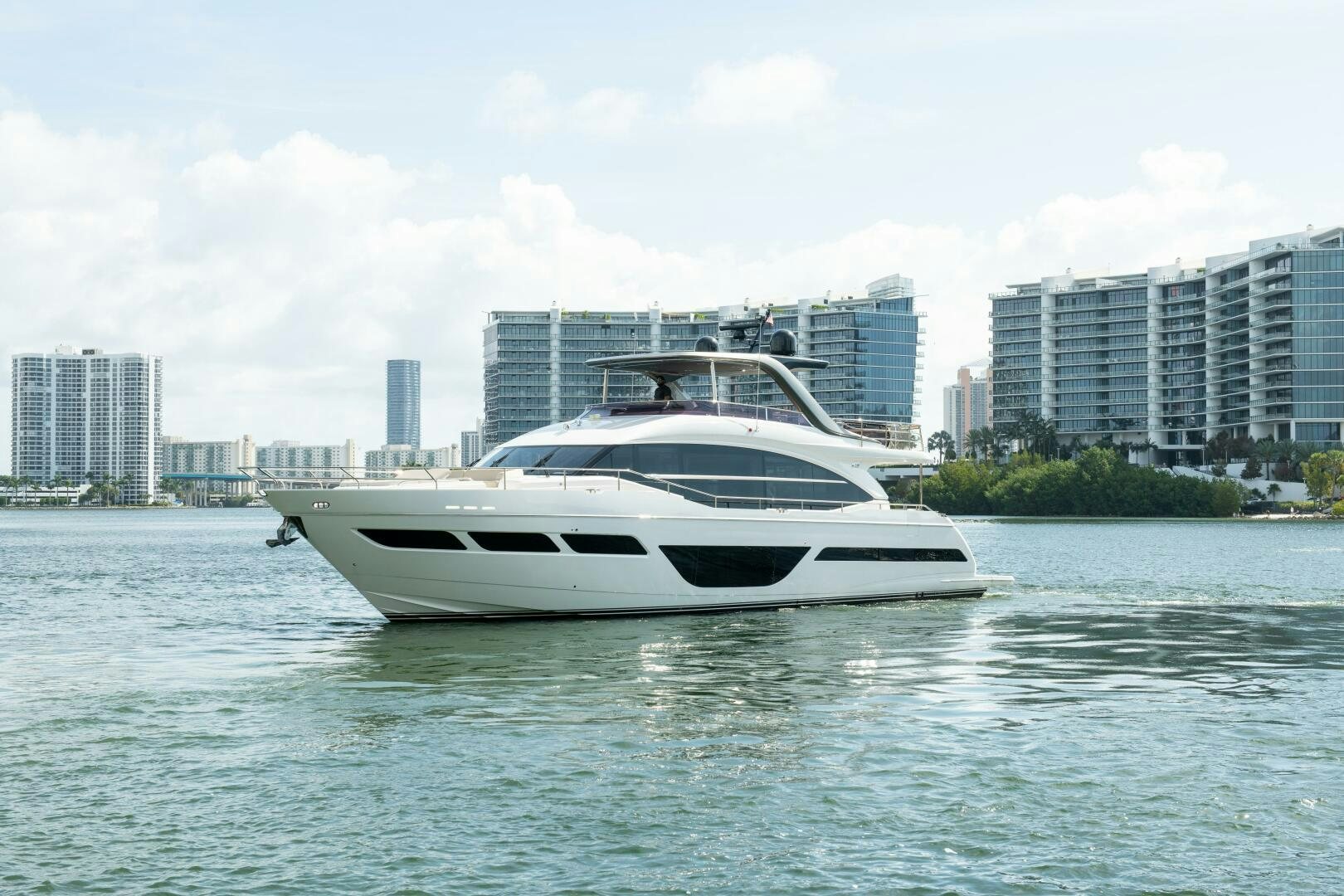 a white yacht in the water aboard OUR ALEPH Yacht for Sale